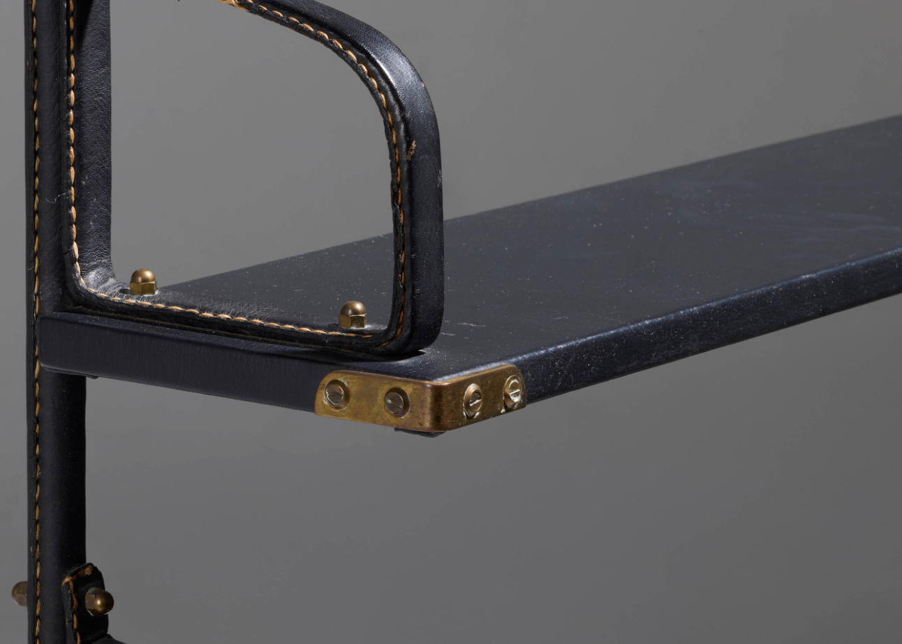 Jacques Adnet stitched leather bookshelf