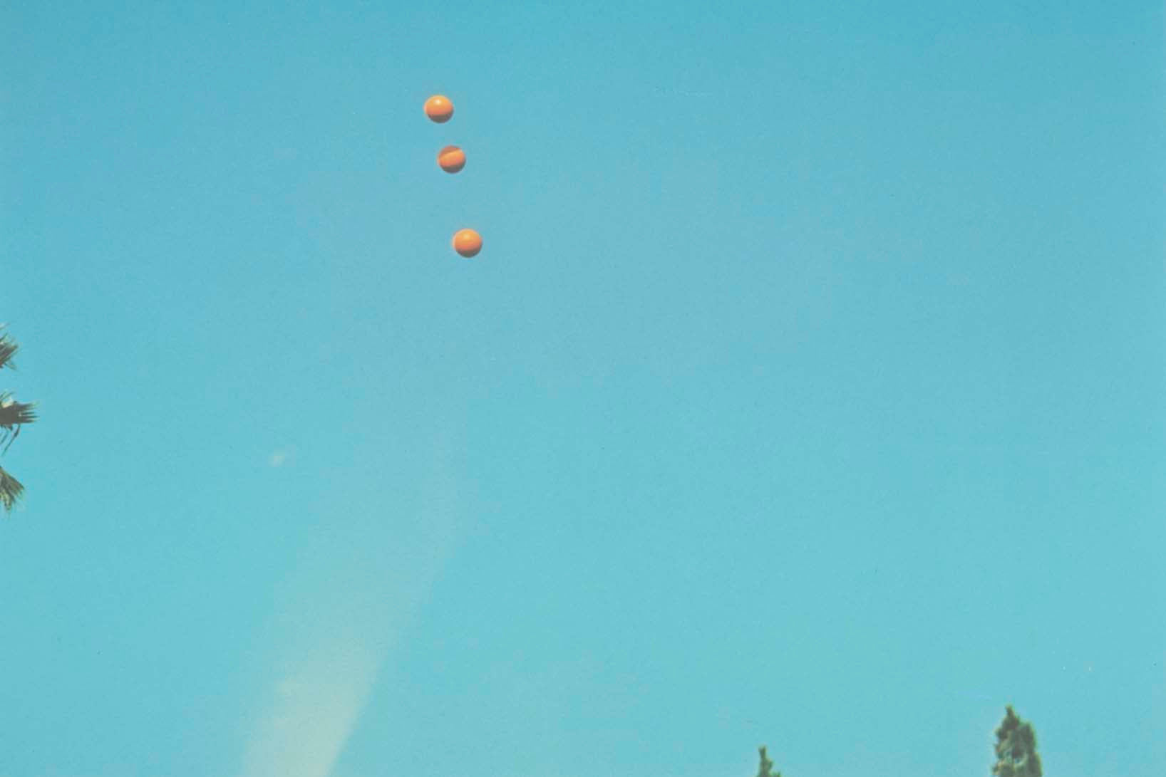 John Baldessari "Throwing Three Balls in the Air to get a Straight Line" , 1973