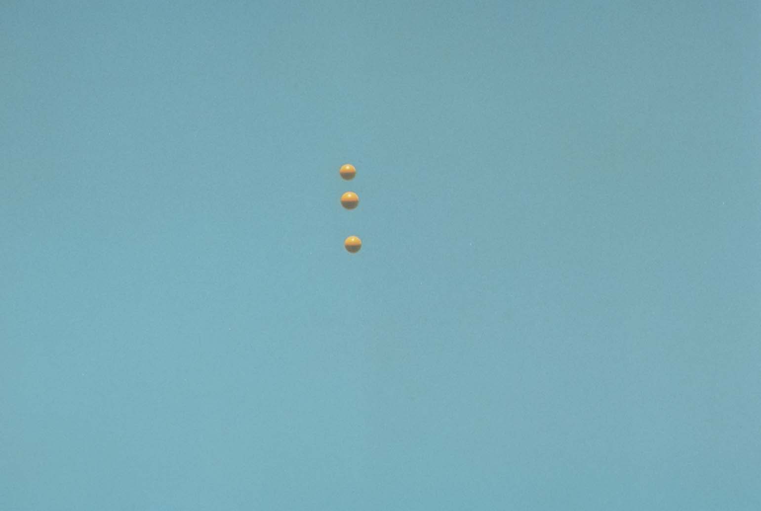 John Baldessari "Throwing Three Balls in the Air to get a Straight Line" , 1973