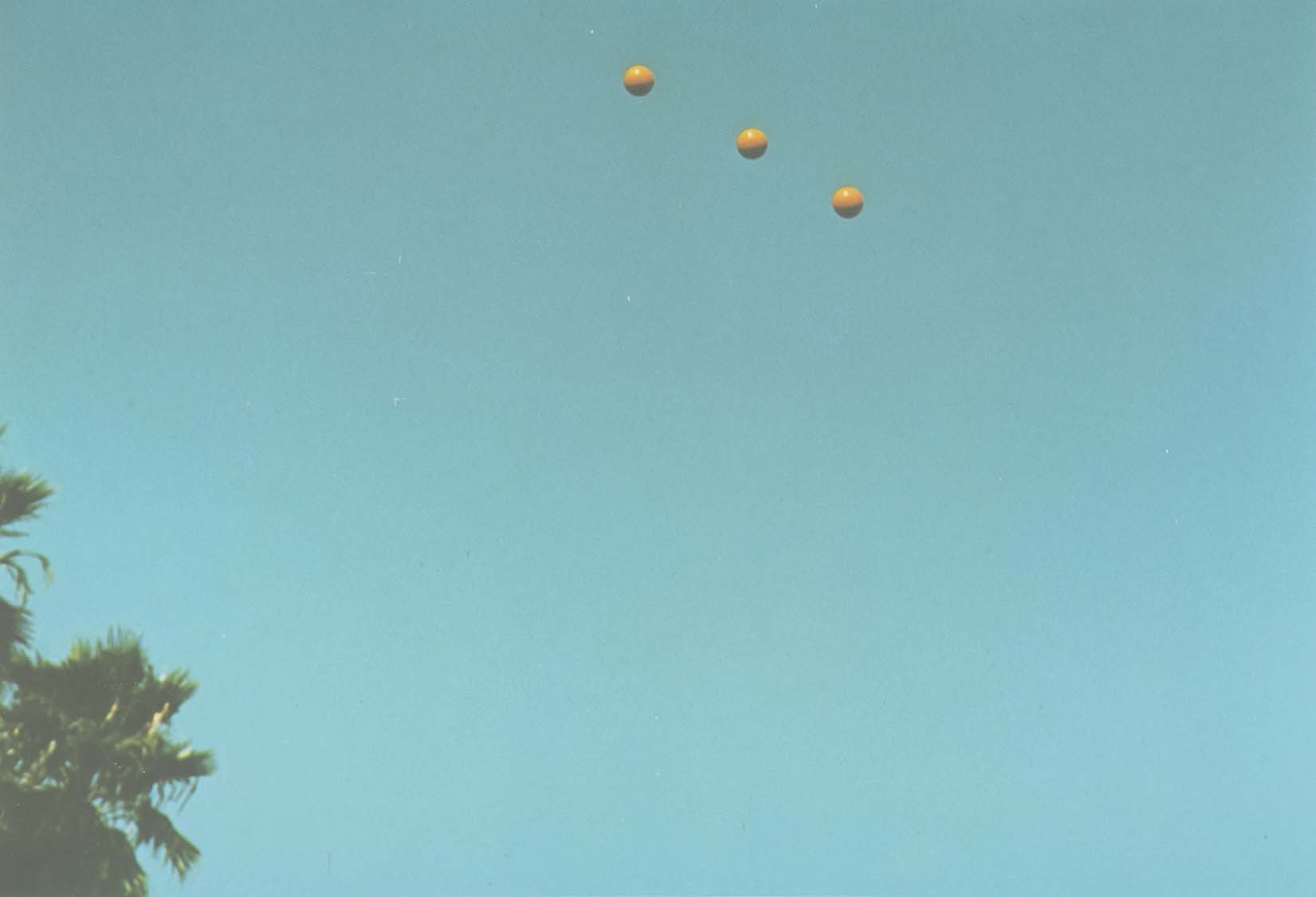 John Baldessari "Throwing Three Balls in the Air to get a Straight Line" , 1973