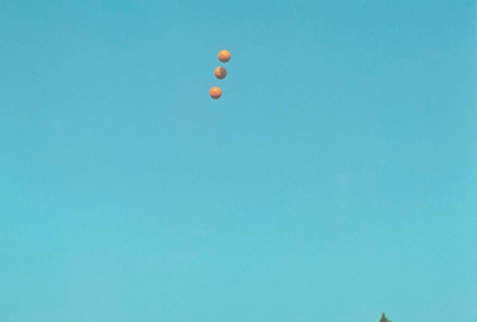 John Baldessari "Throwing Three Balls in the Air to get a Straight Line" , 1973