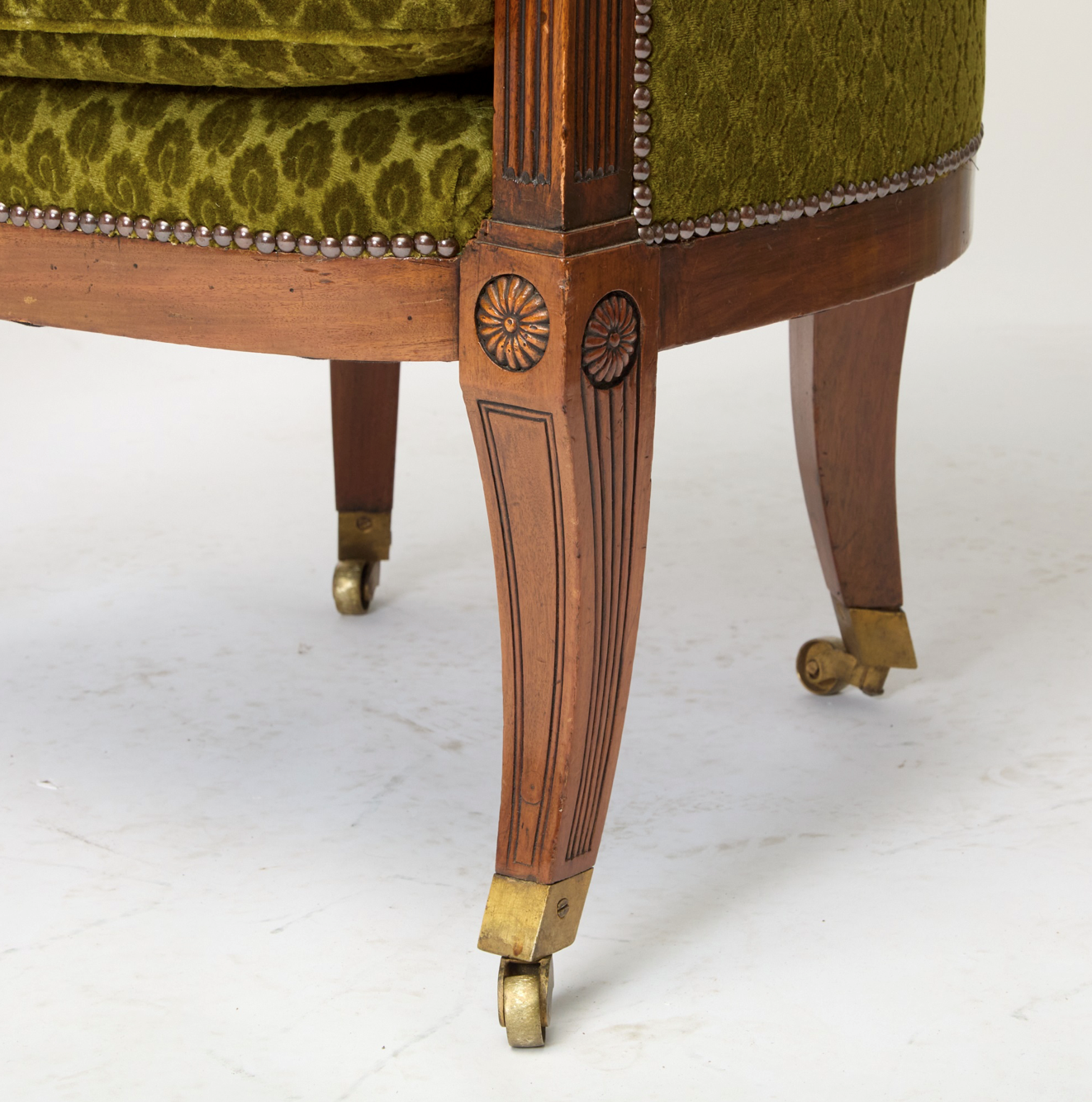 Pair of English Regency Mahogany Bergeres in the Manner of George Oakley