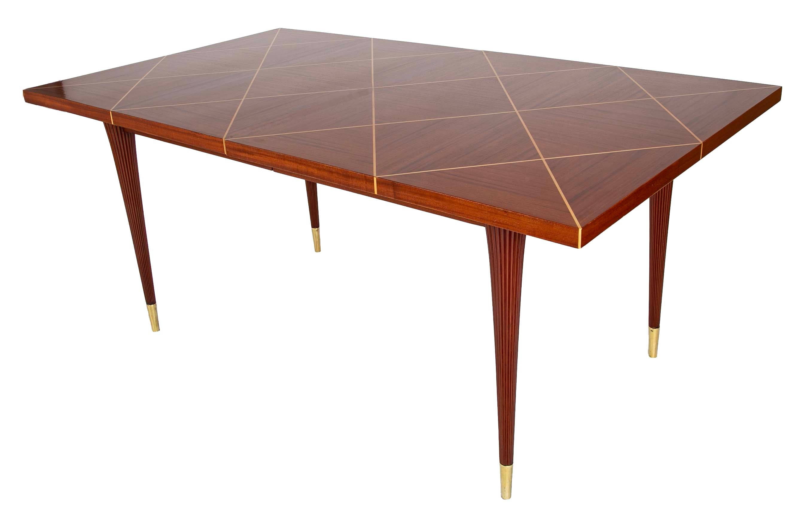 A Tommi Parzinger For Charak Modern Mahogany and Maple Dining Table With Leaves.