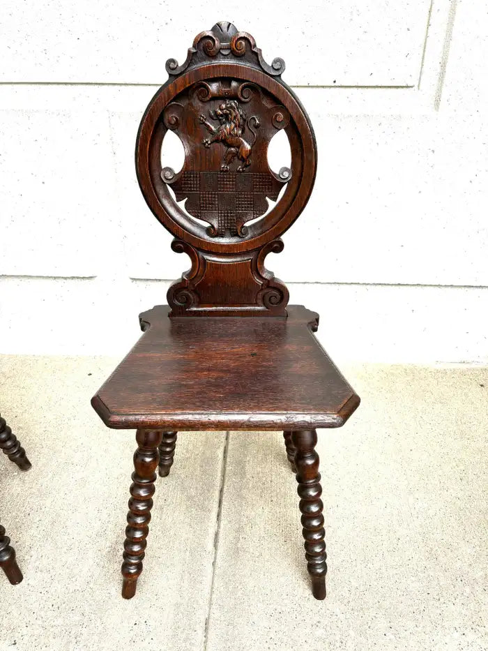 Pair 18th Century Italian Chestnut Hall Chairs Carved With Lion Crests