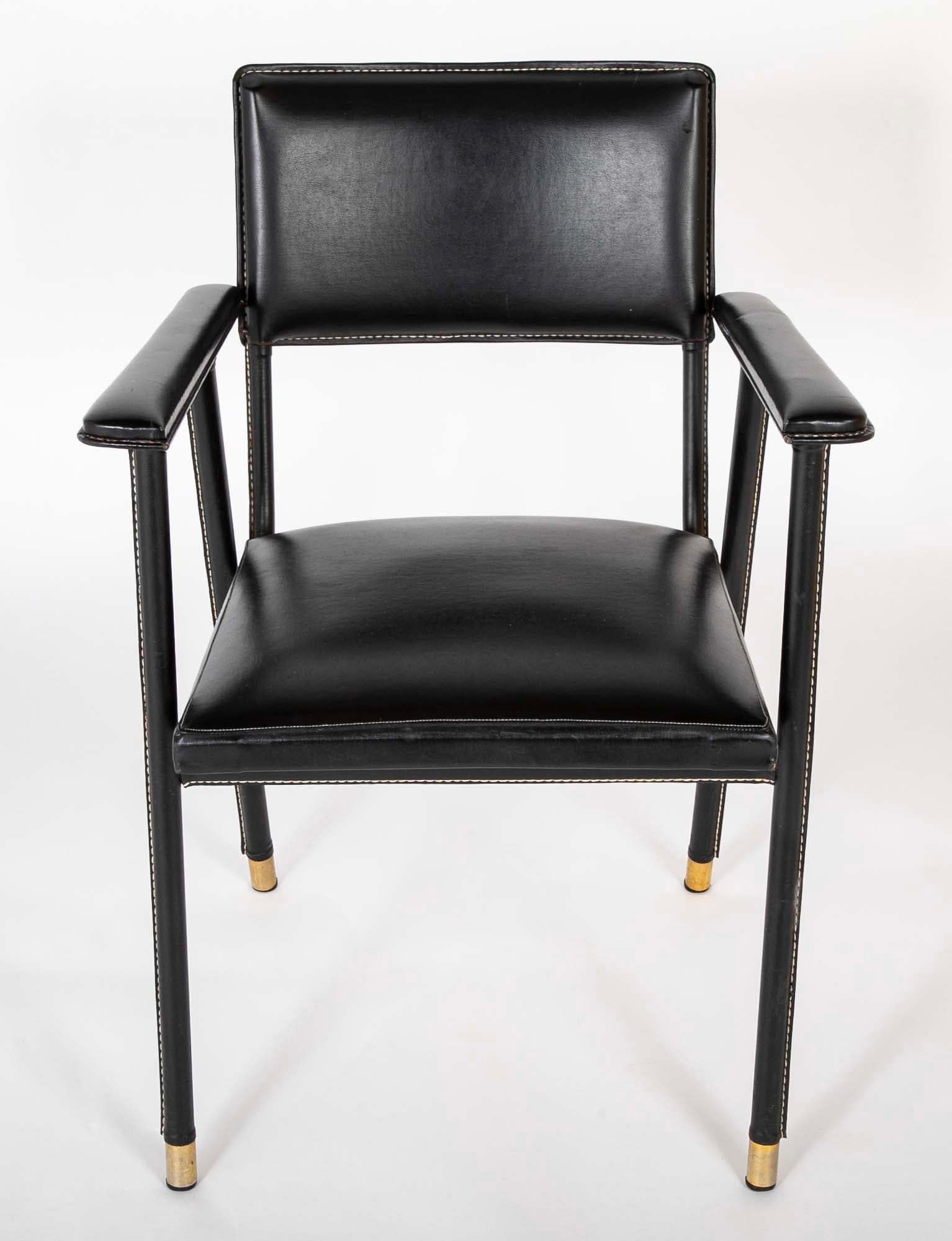 A Black Vinyl Wrapped Armchair Attributed to Jacques Adnet