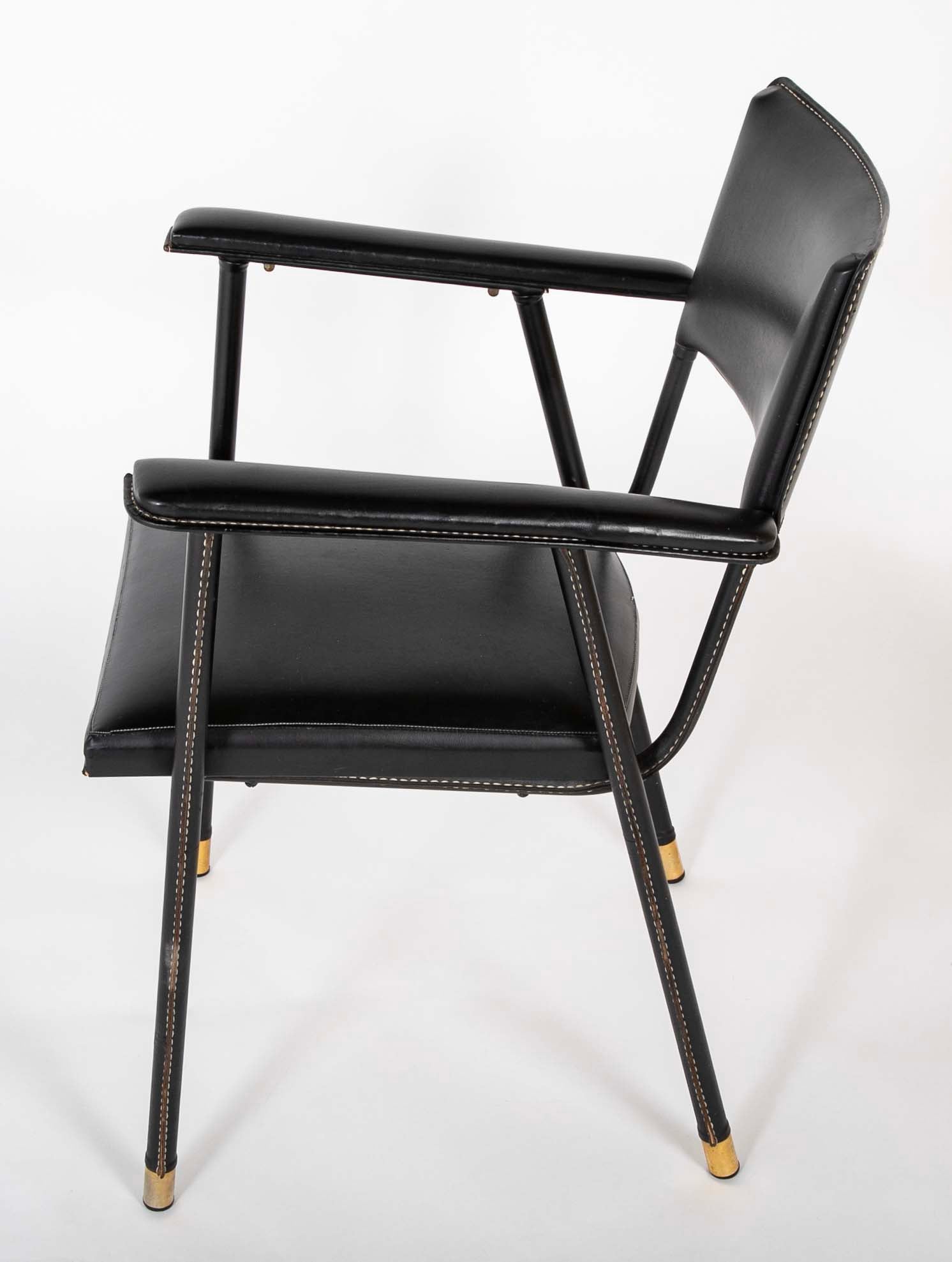 A Black Vinyl Wrapped Armchair Attributed to Jacques Adnet