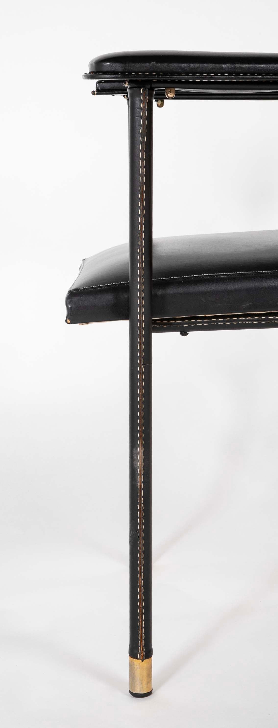 A Black Vinyl Wrapped Armchair Attributed to Jacques Adnet