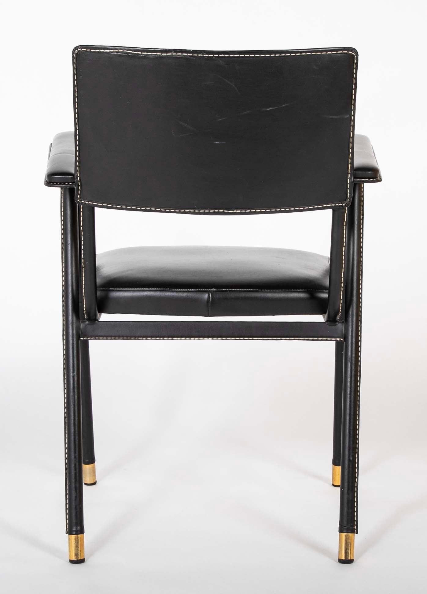 A Black Vinyl Wrapped Armchair Attributed to Jacques Adnet