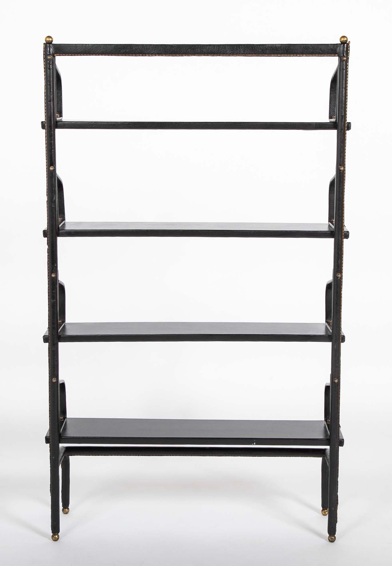 A Jacques Adnet Stitched Black Leather Covered Small Bookcase