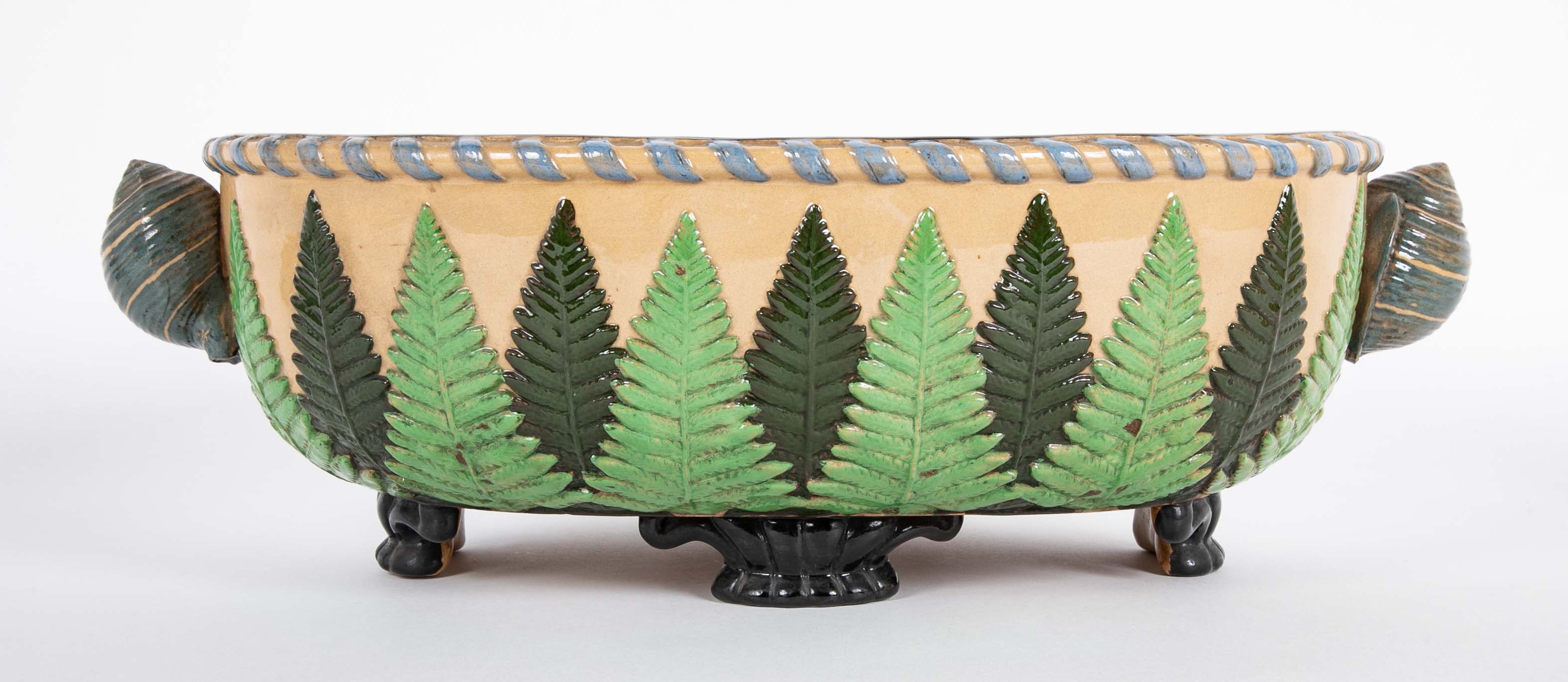 Majolica Slip Glazed Oval Jardiniere With 4 Scrolled Feet And Applied Shell Handles With Green Ferns