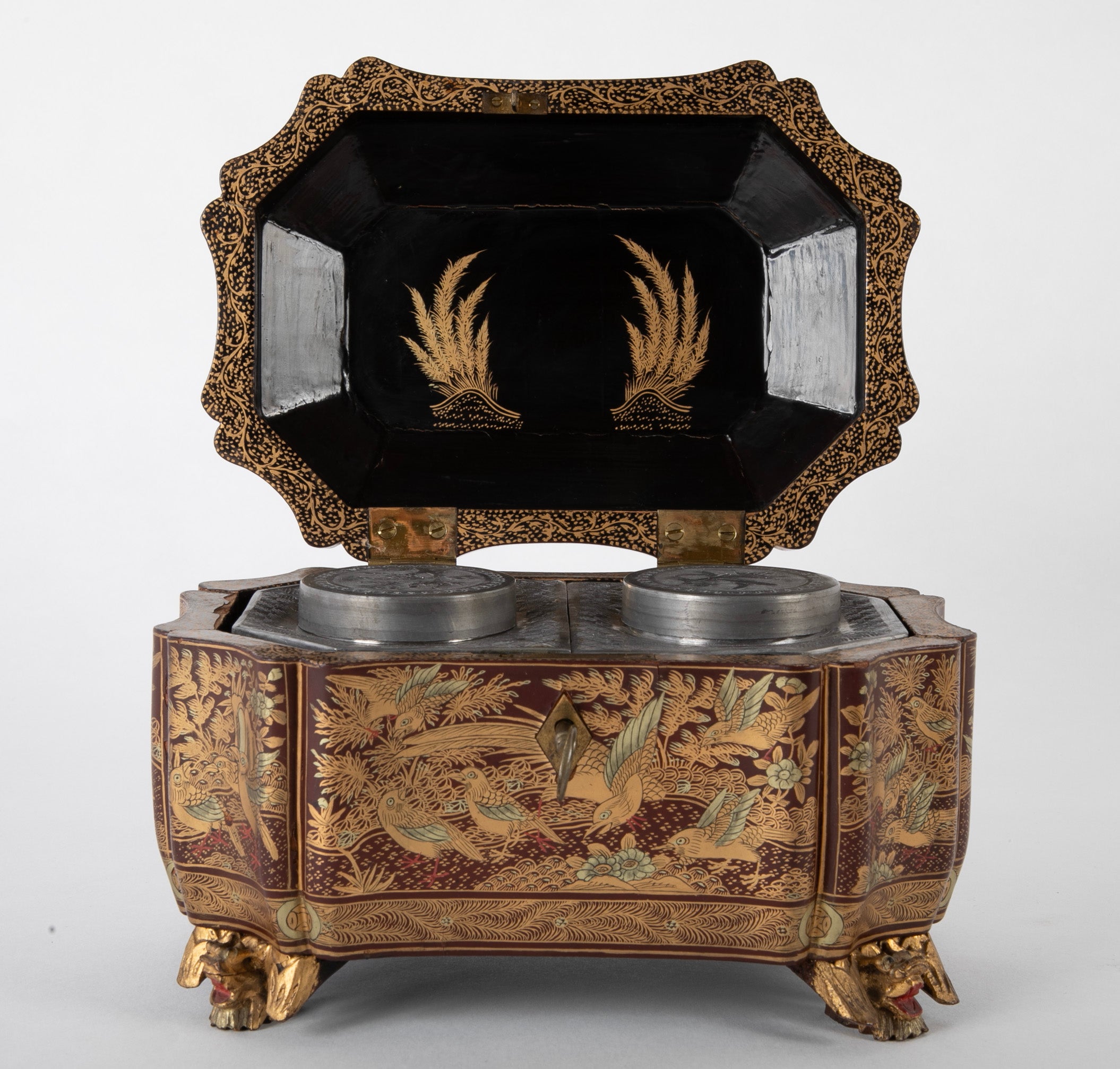 A Chinese Export Lacquered Tea Caddy with Pewter Fitted Interior