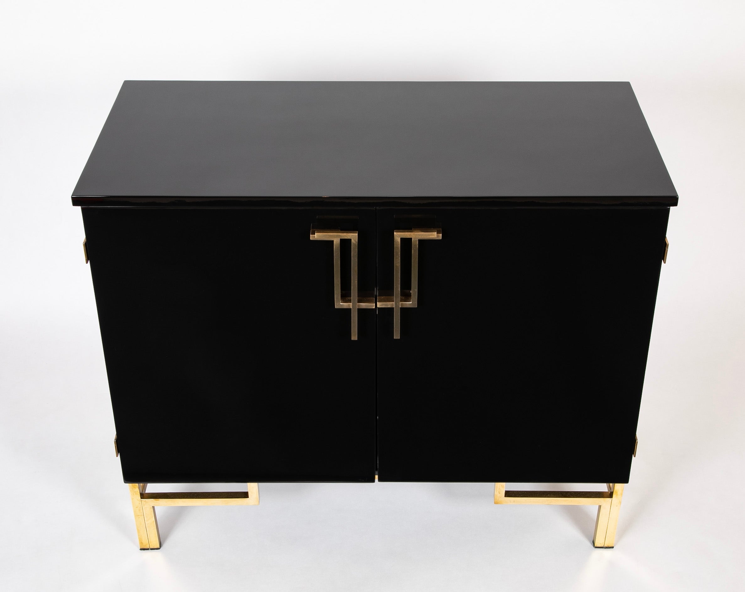 A Maison Jansen Black Lacquer Cabinet with Gilded Brass Accents