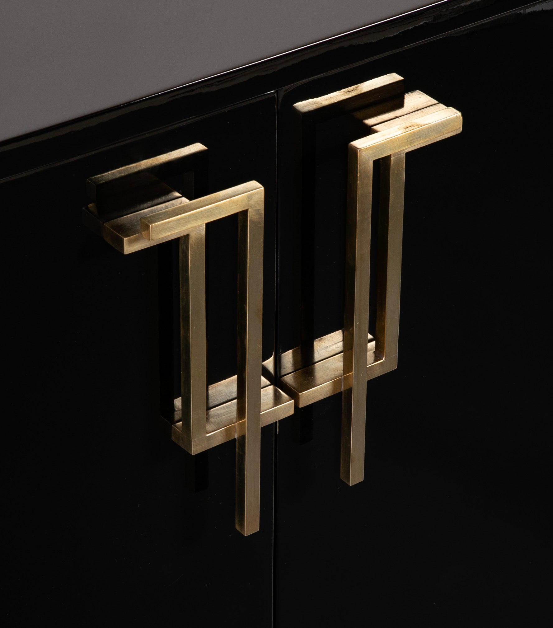 A Maison Jansen Black Lacquer Cabinet with Gilded Brass Accents