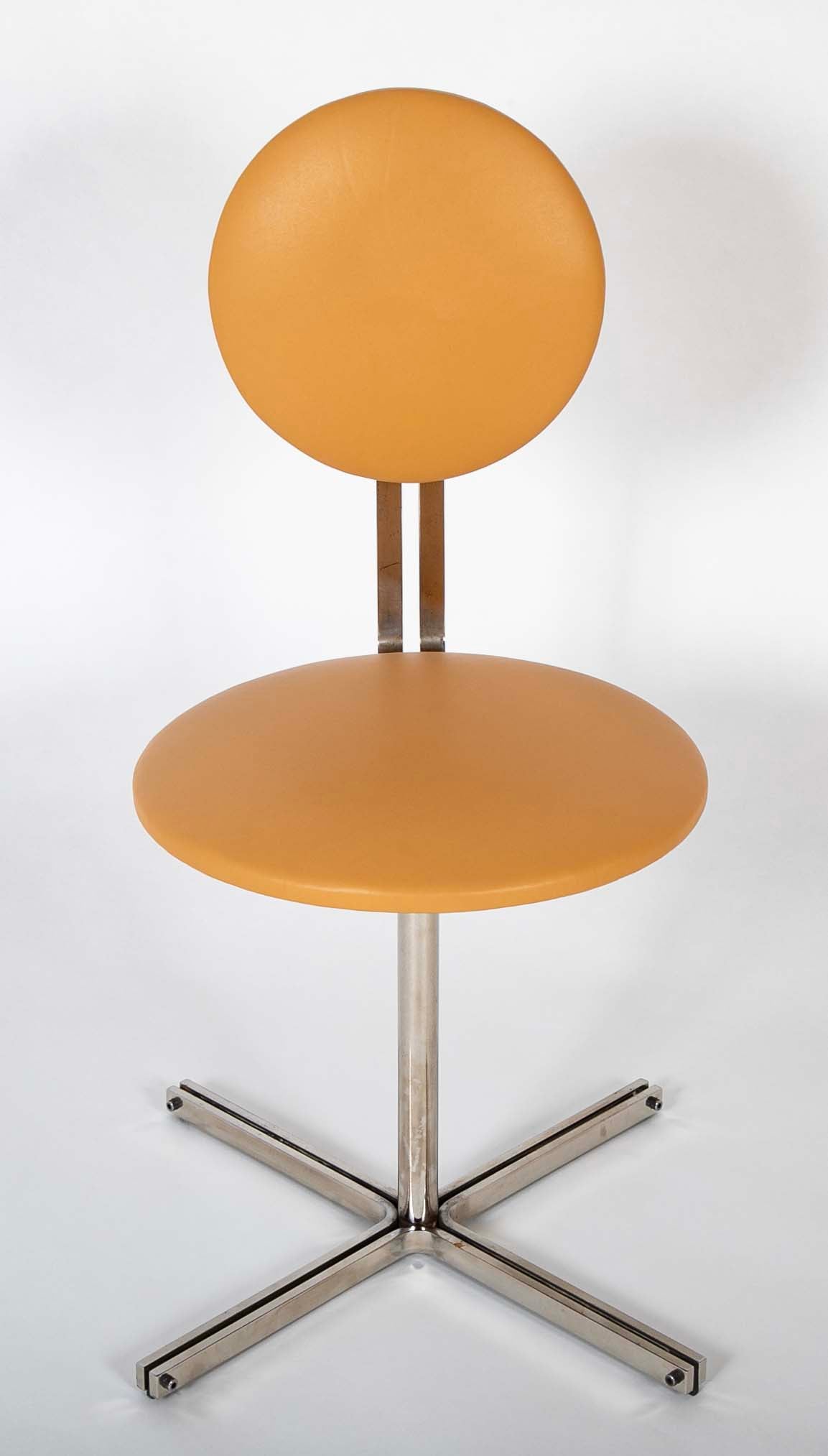 A Mid-Century Leather Upholstered Swirl Chair