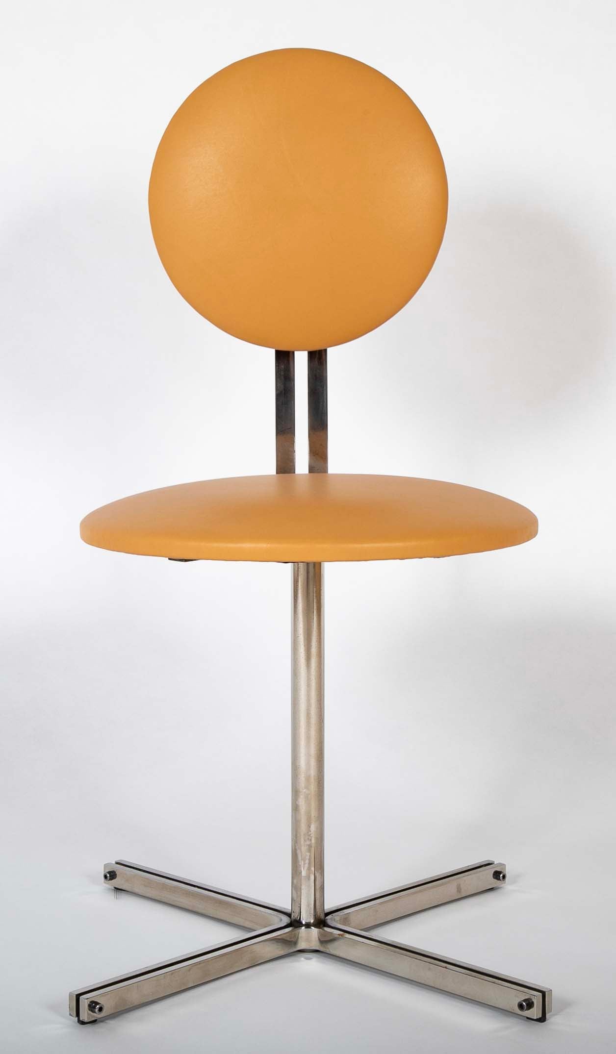 A Mid-Century Leather Upholstered Swirl Chair