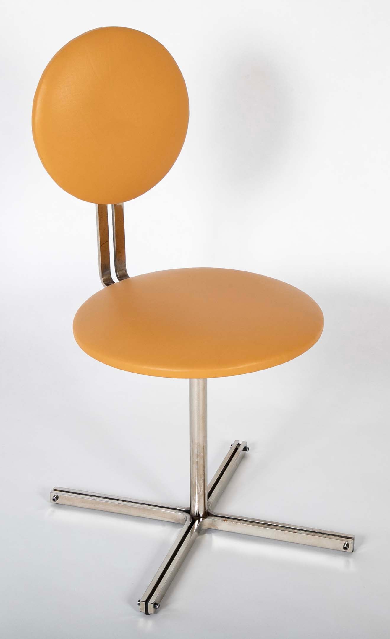 A Mid-Century Leather Upholstered Swirl Chair
