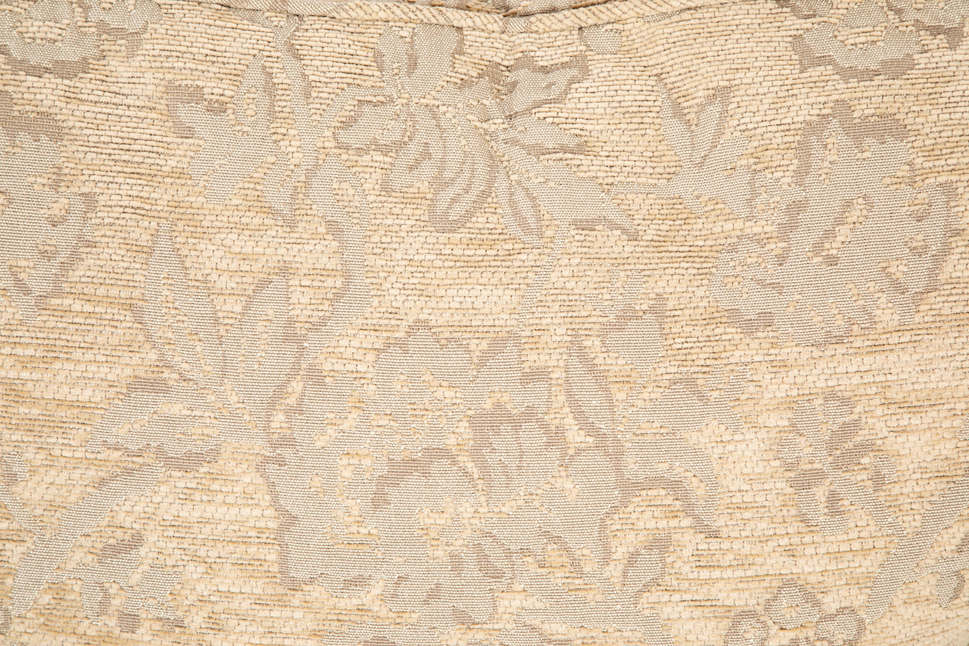 A Current Upholstered Armchair with Matched Ottoman
