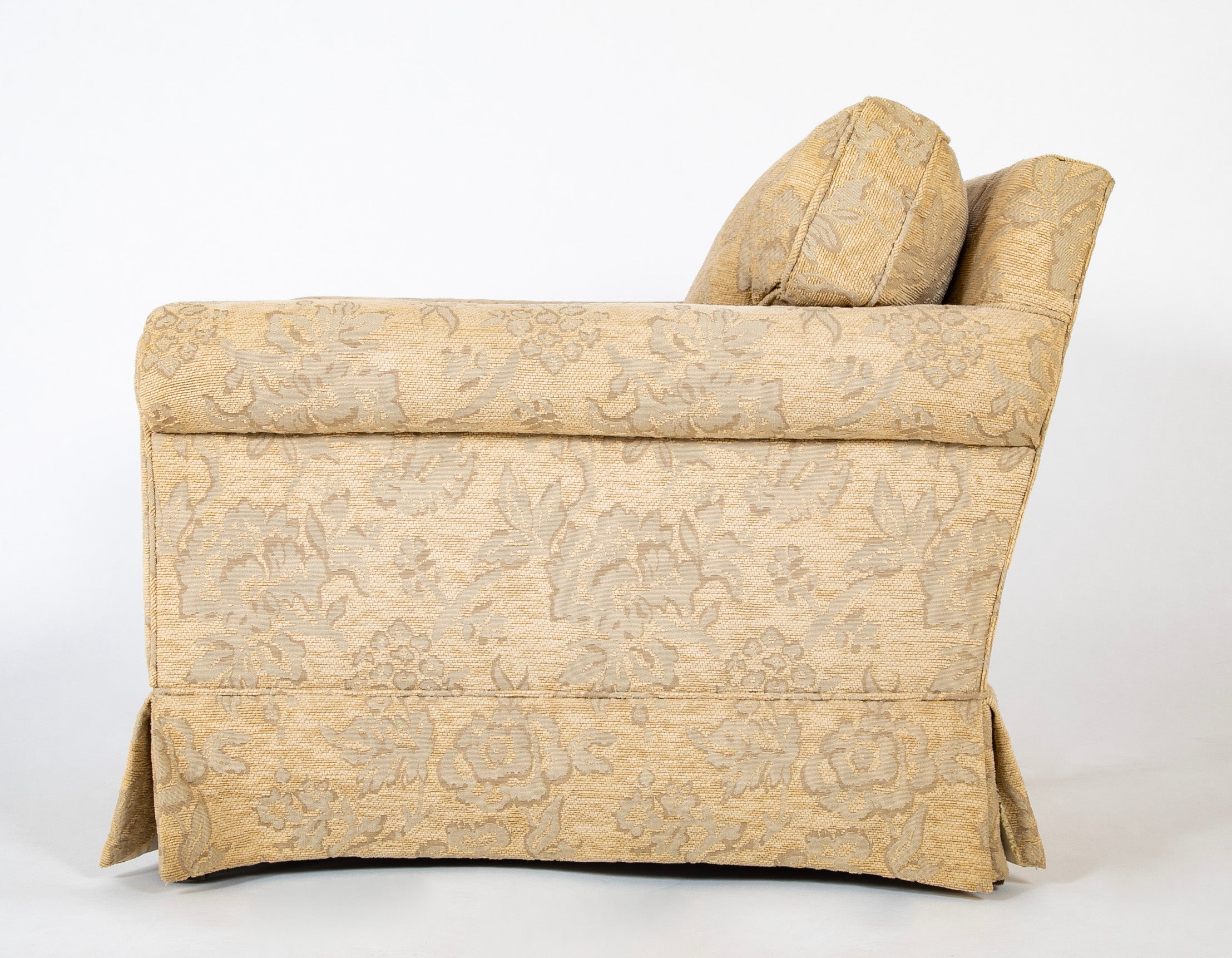 A Current Upholstered Armchair with Matched Ottoman