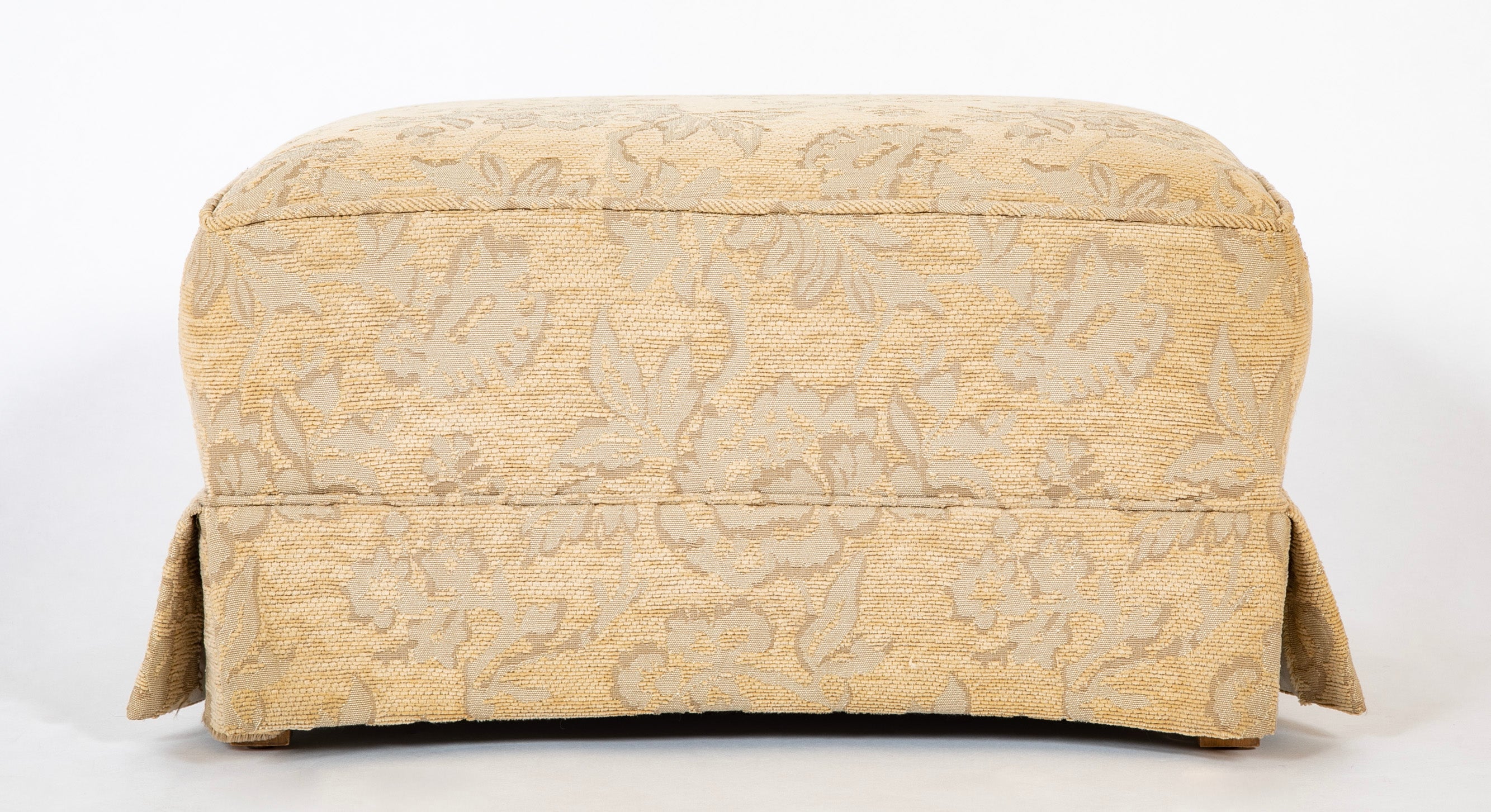 A Current Upholstered Armchair with Matched Ottoman