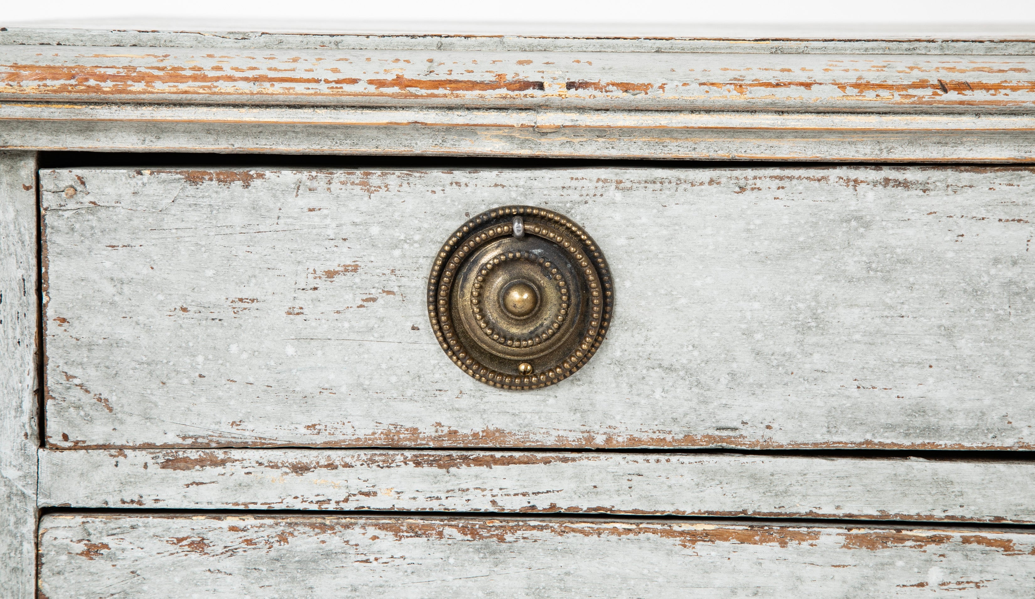 A Louis XVI White Painted Four Drawer Chest