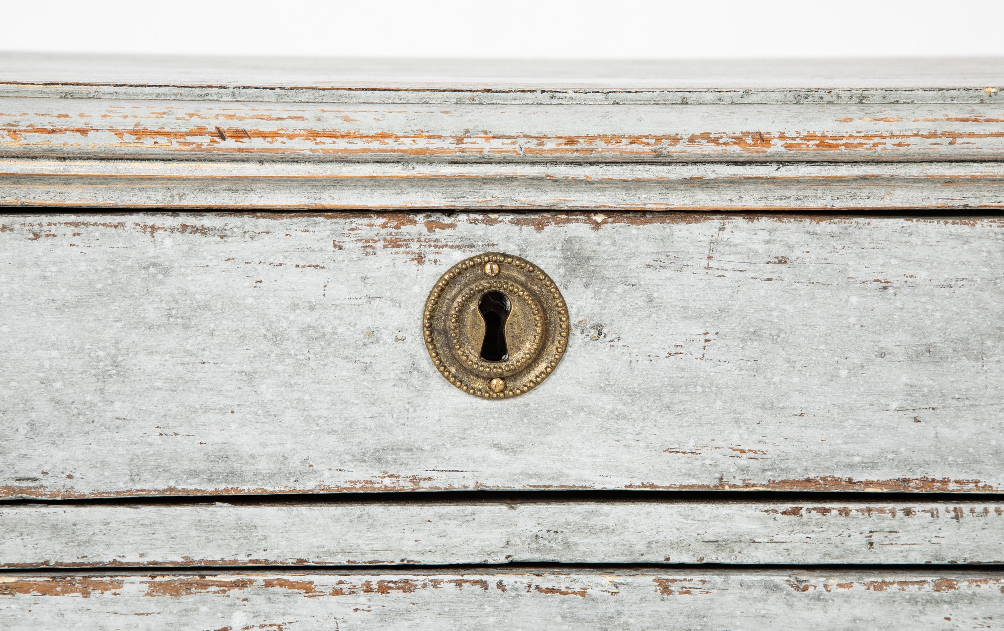 A Louis XVI White Painted Four Drawer Chest