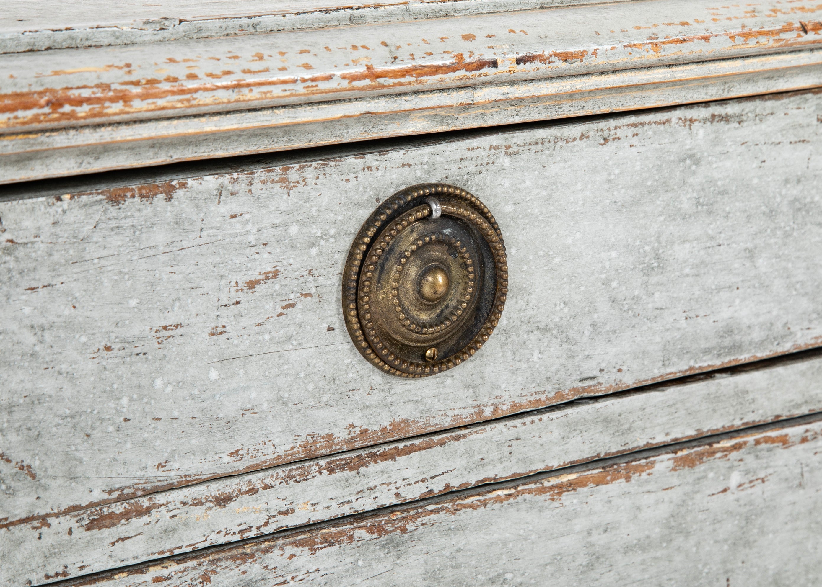 A Louis XVI White Painted Four Drawer Chest
