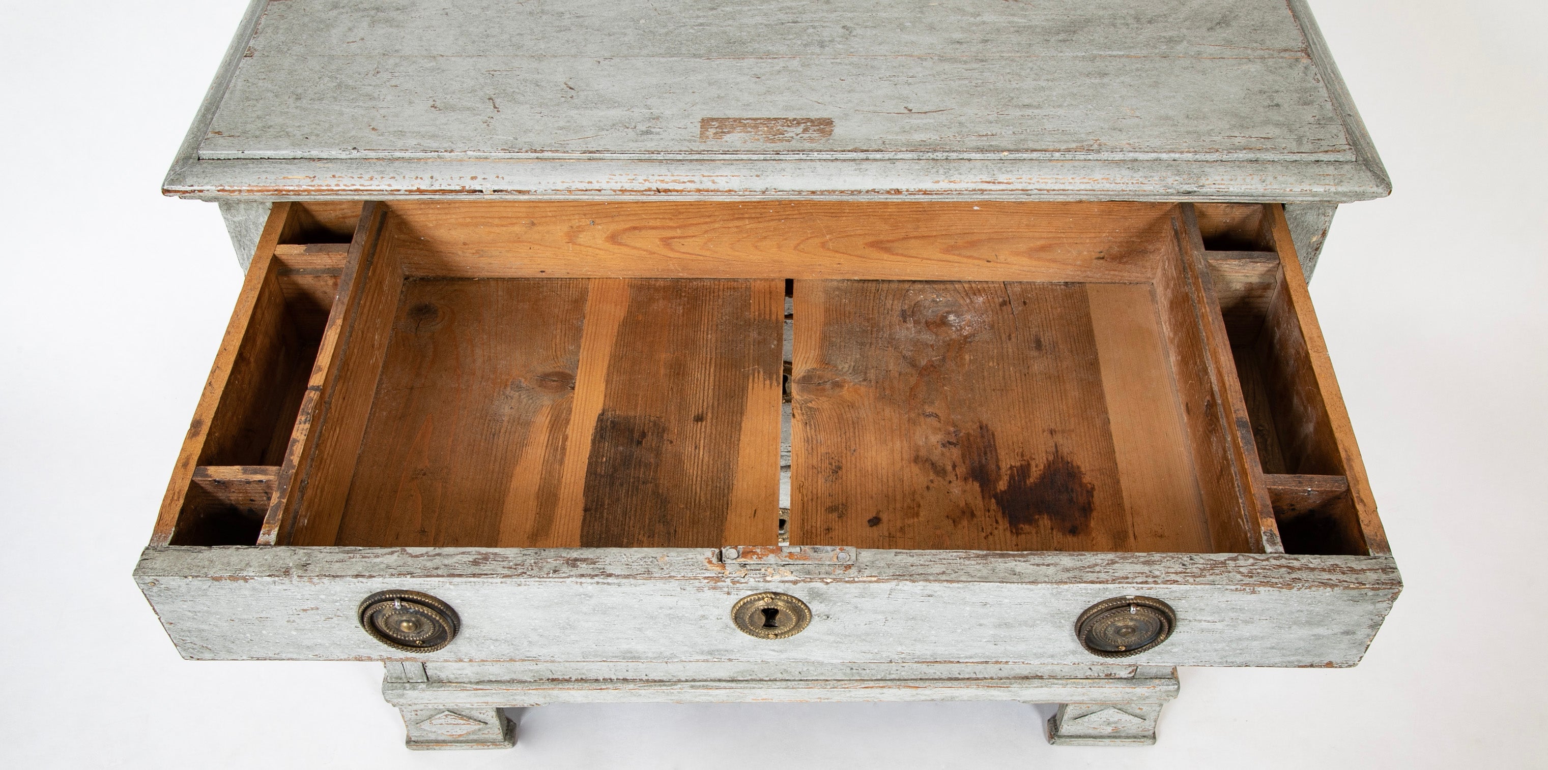A Louis XVI White Painted Four Drawer Chest