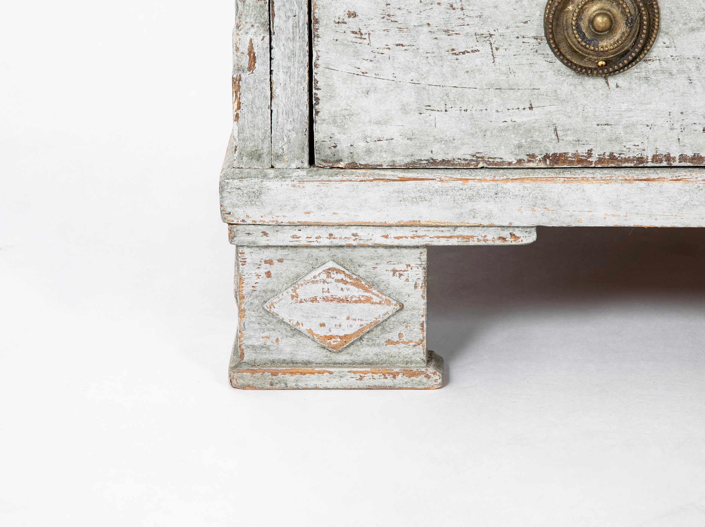 A Louis XVI White Painted Four Drawer Chest