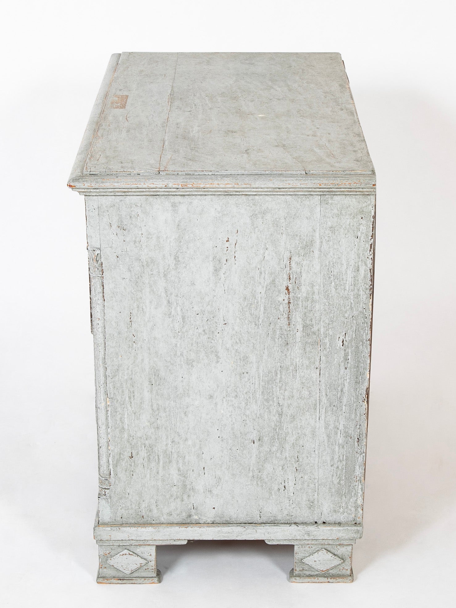 A Louis XVI White Painted Four Drawer Chest