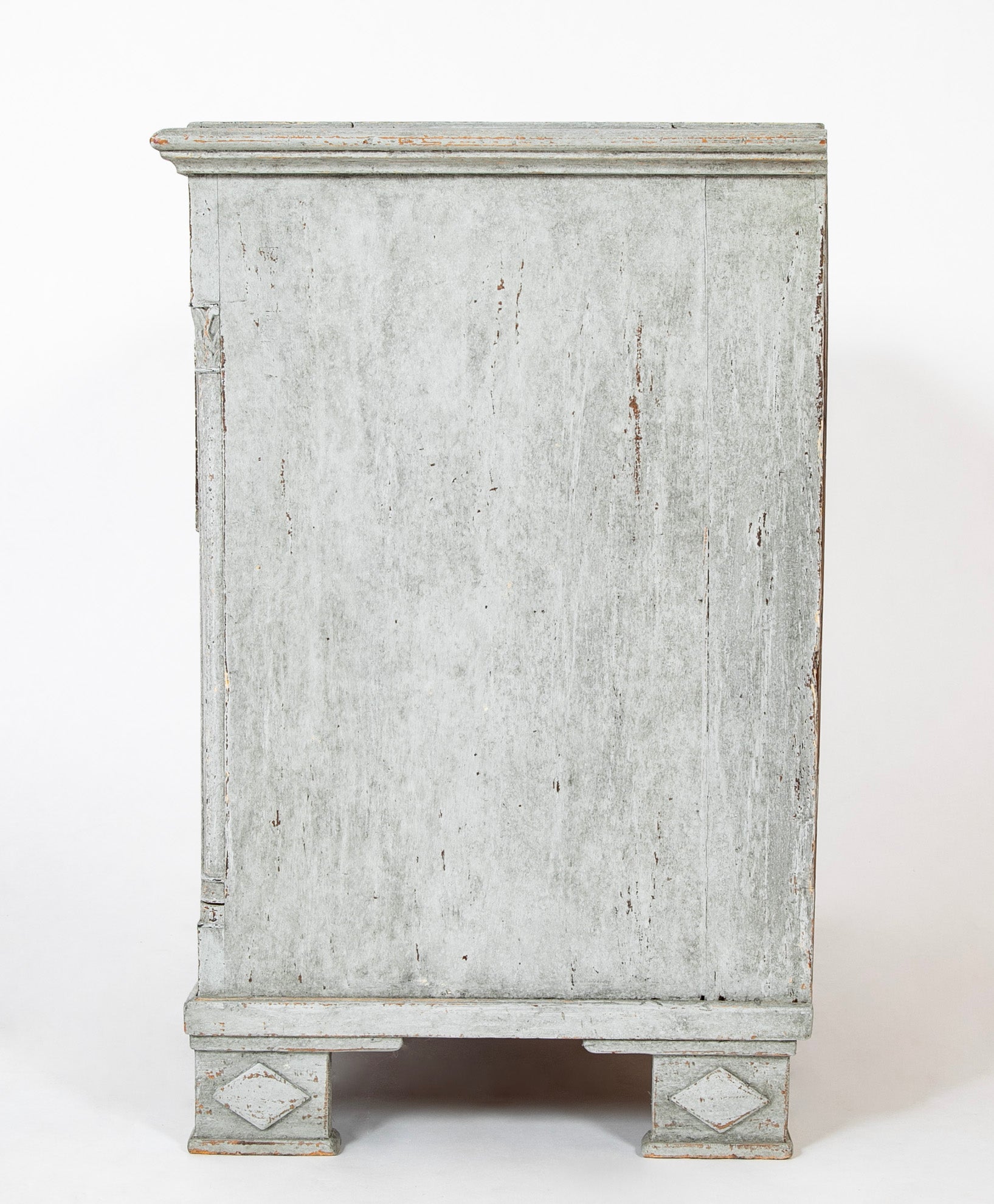 A Louis XVI White Painted Four Drawer Chest