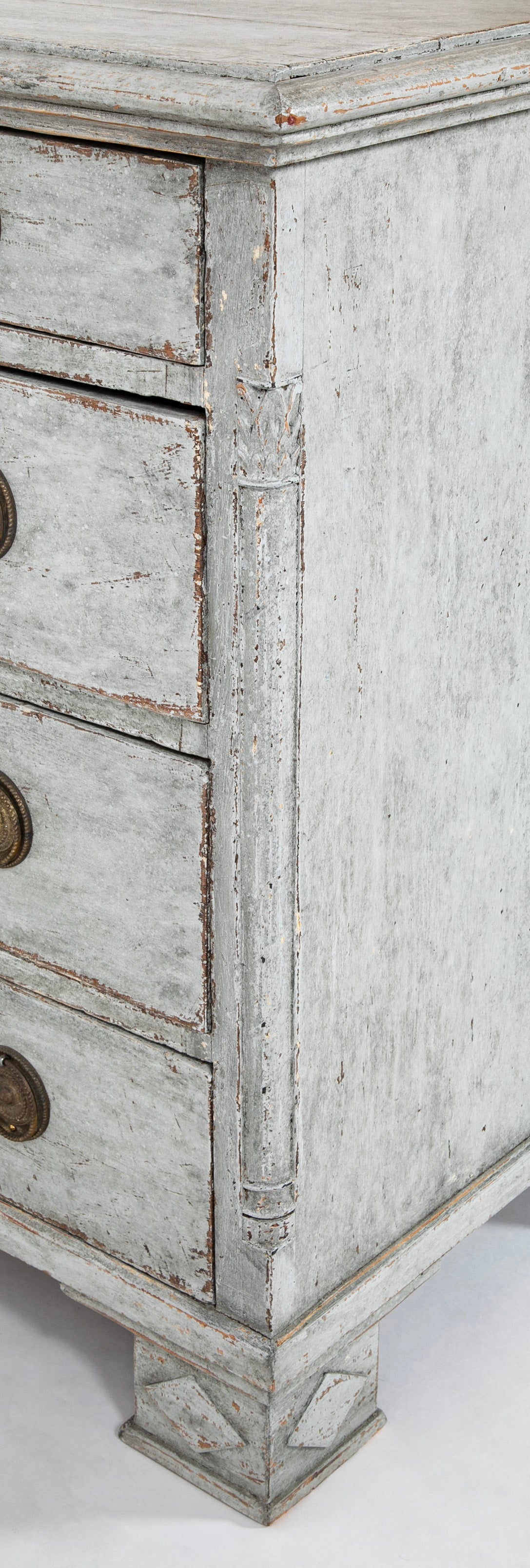 A Louis XVI White Painted Four Drawer Chest