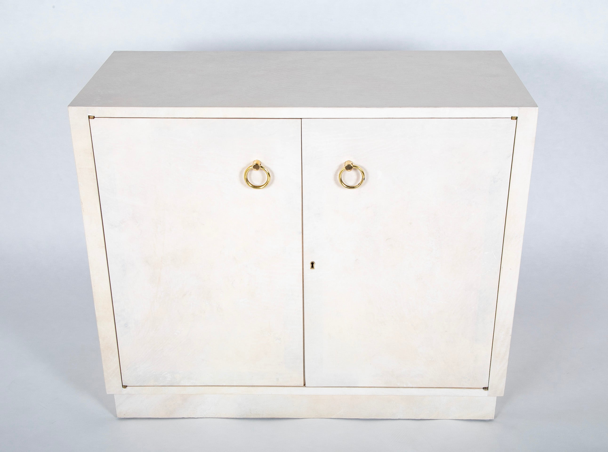 Pair of Two Door Parchment Cabinets in the Manner of Samuel Marx