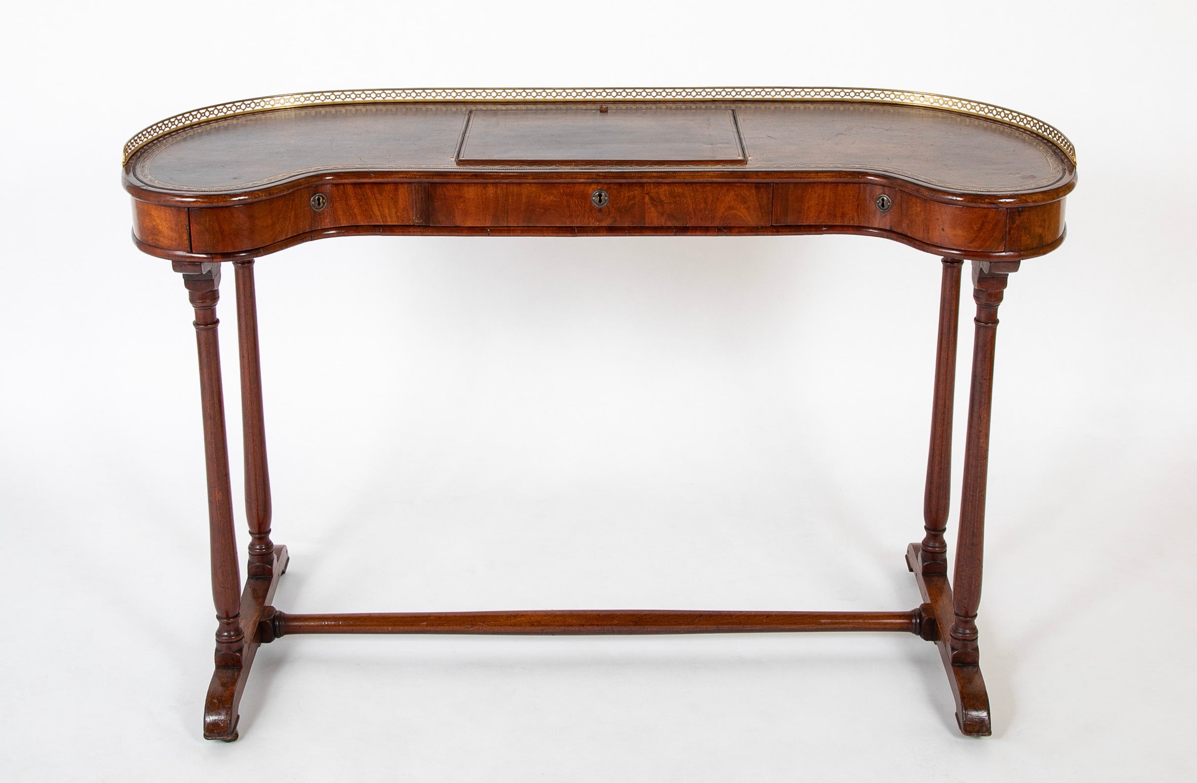 An English Regency Kidney Shaped Mahogany Desk