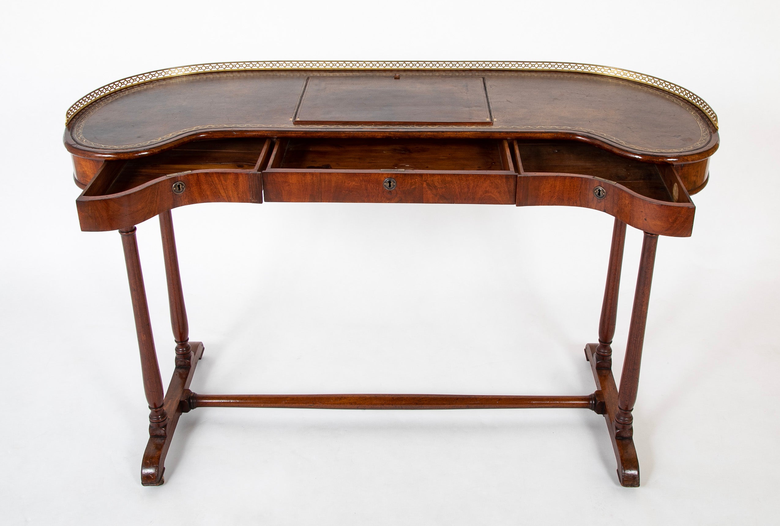 An English Regency Kidney Shaped Mahogany Desk