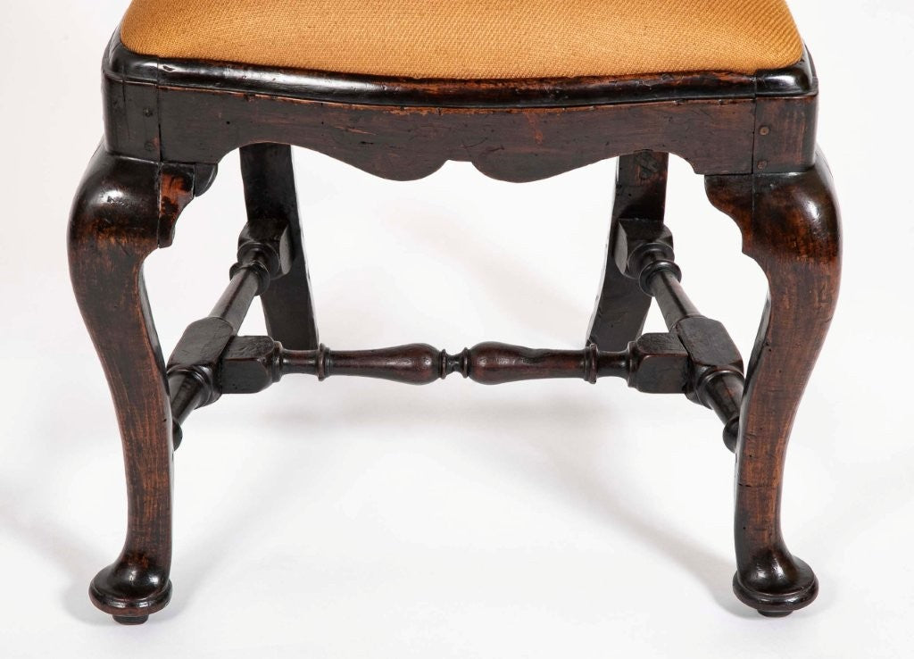 A set of 10 Queen Anne Black Painted Dining Chairs