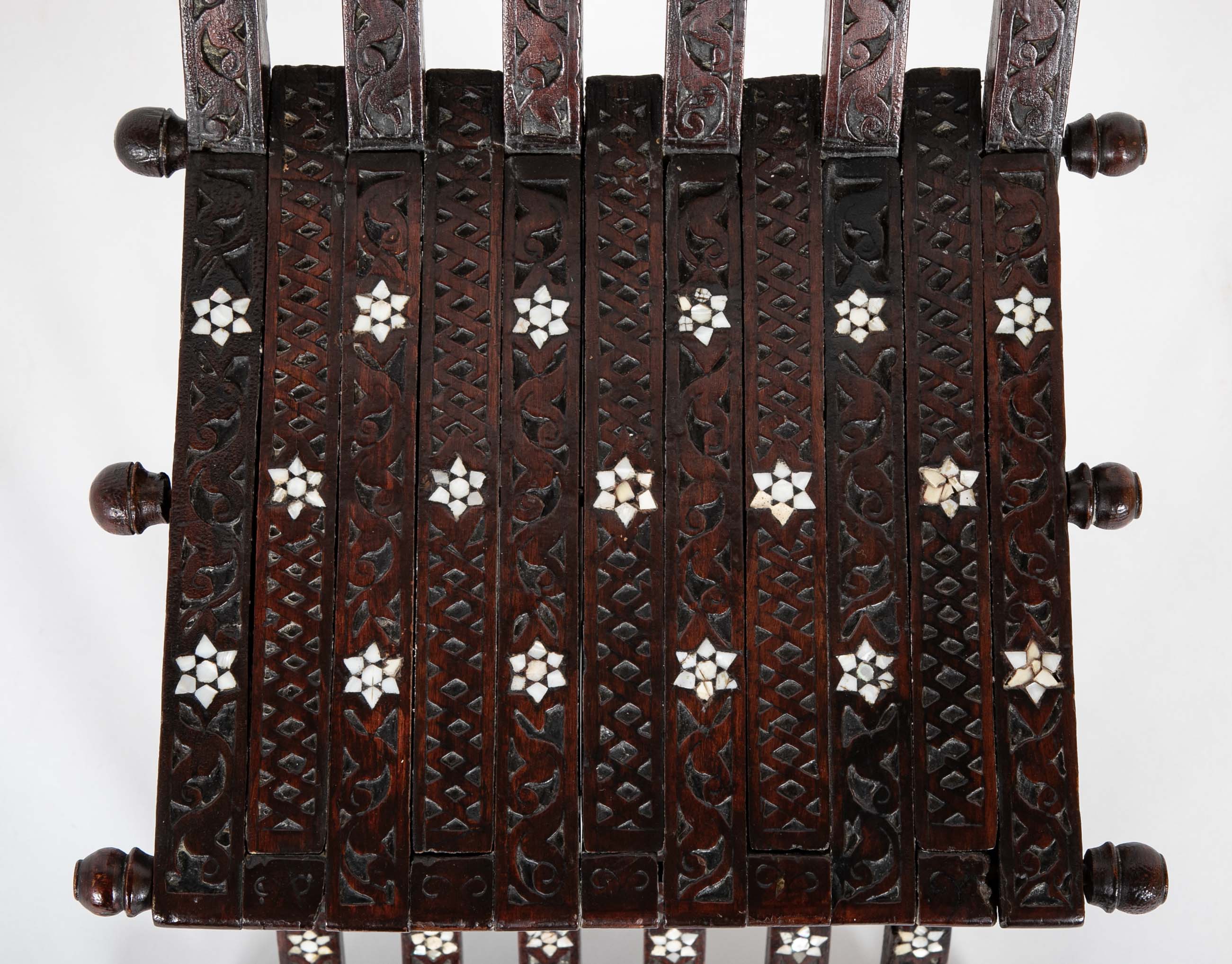 A Syrian Carved Hardwood Folding Chair with Abalone Inlays