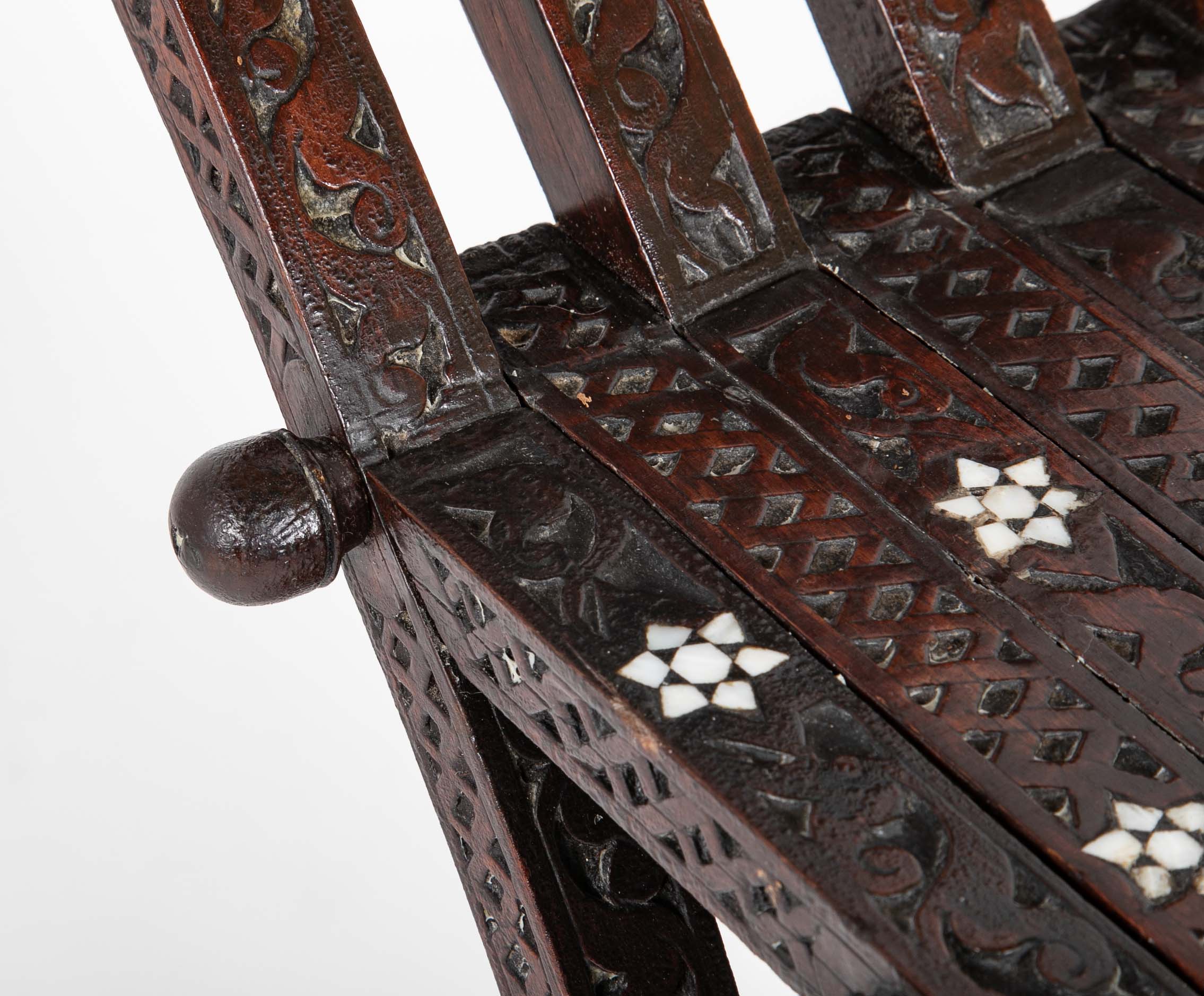 A Syrian Carved Hardwood Folding Chair with Abalone Inlays