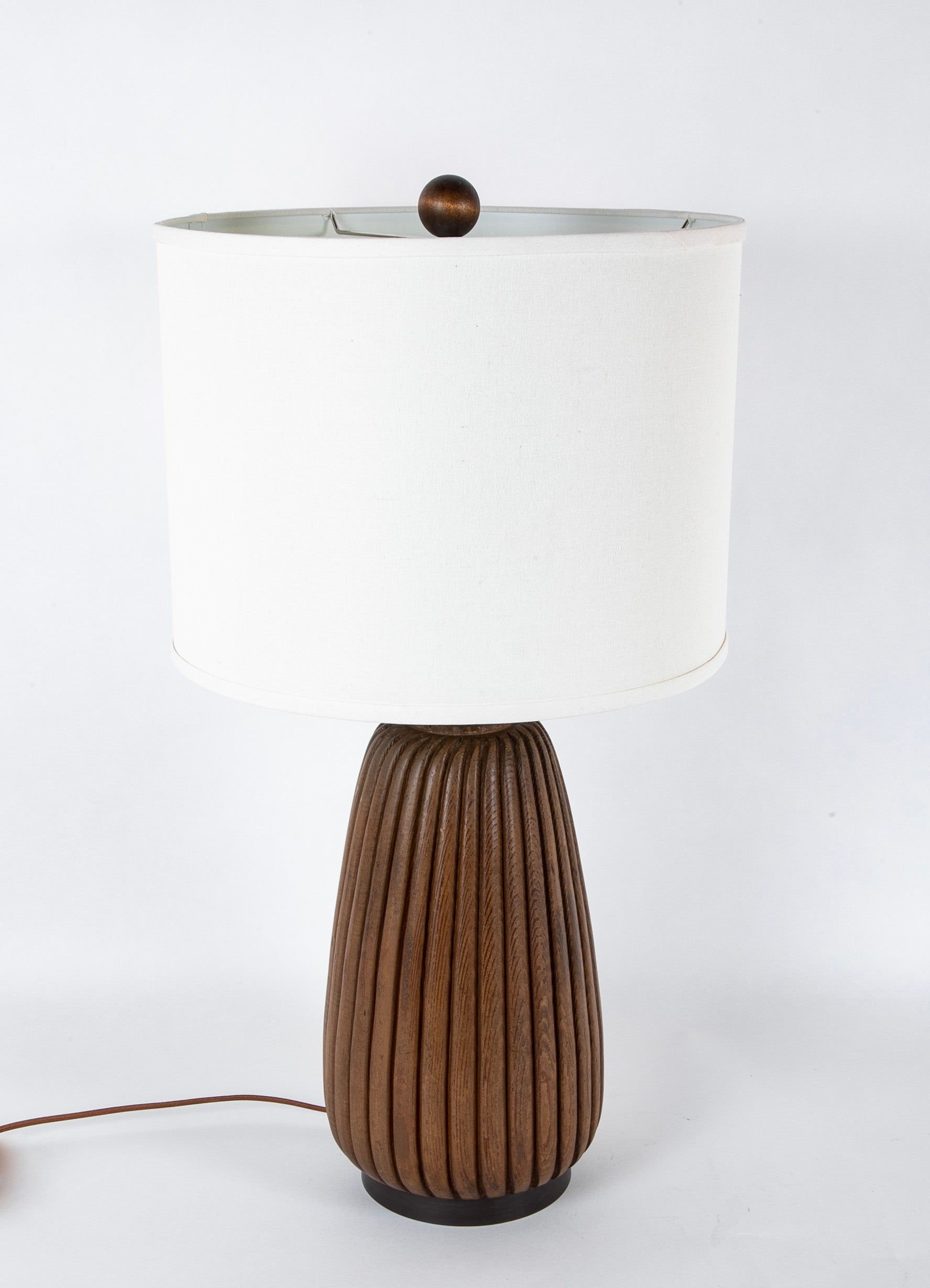 An Elongated Melon Shaped Wooden Lamp