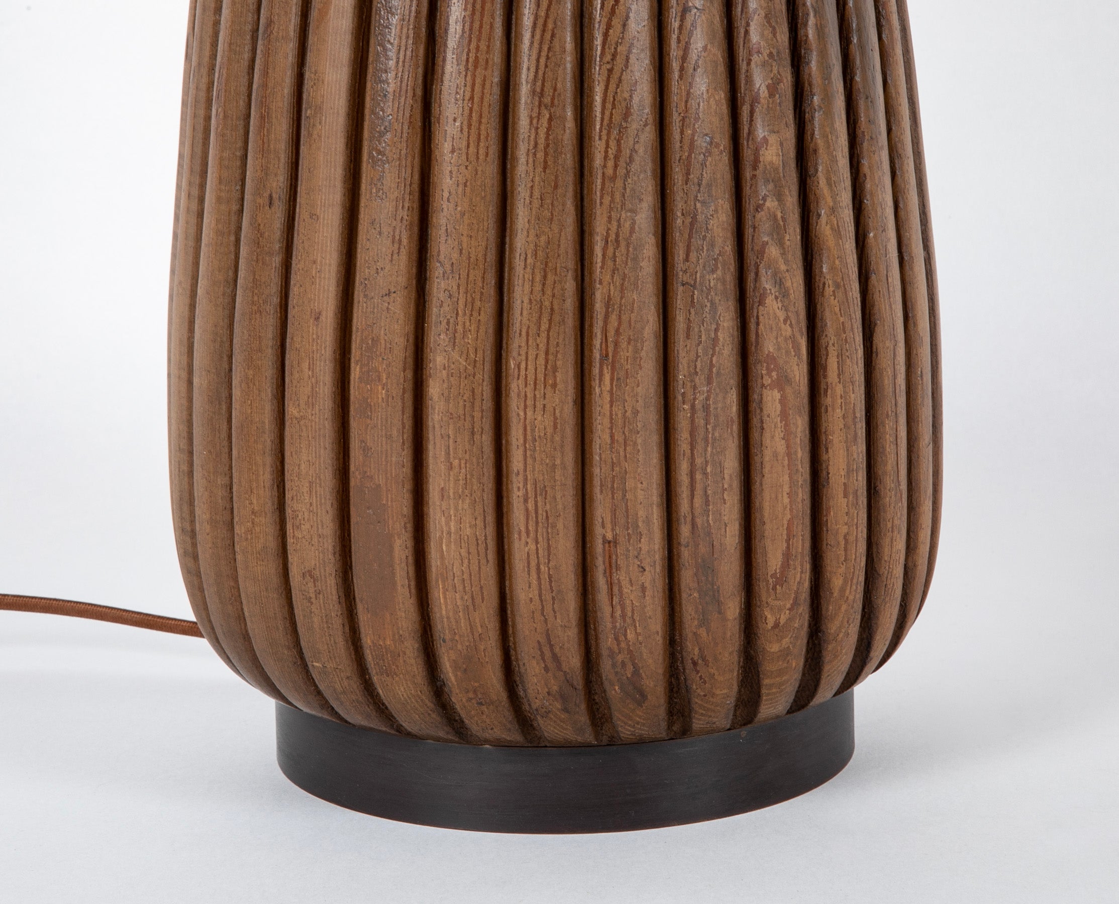 An Elongated Melon Shaped Wooden Lamp