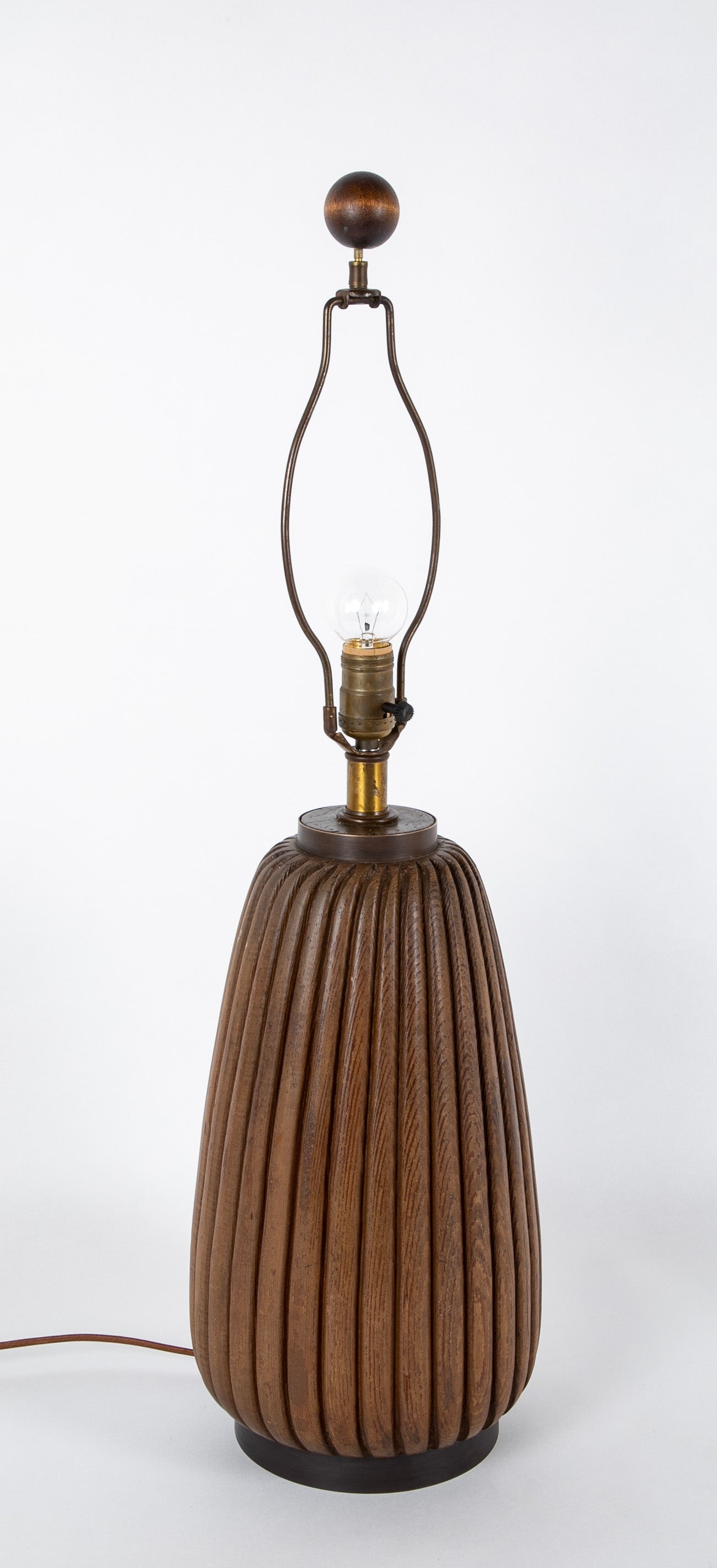 An Elongated Melon Shaped Wooden Lamp
