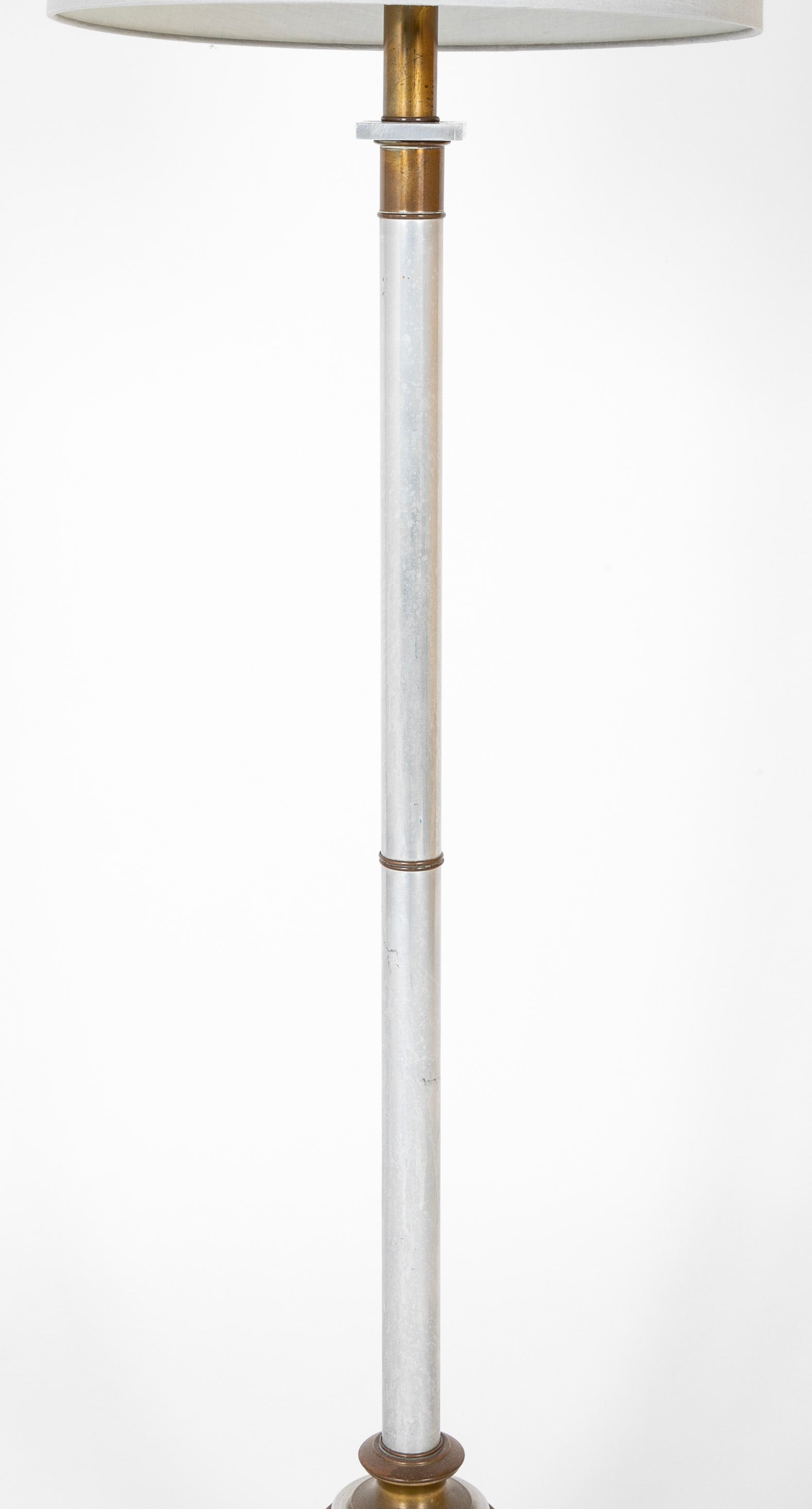 A Mid-Century Brass & Polished Metal Floor Lamp