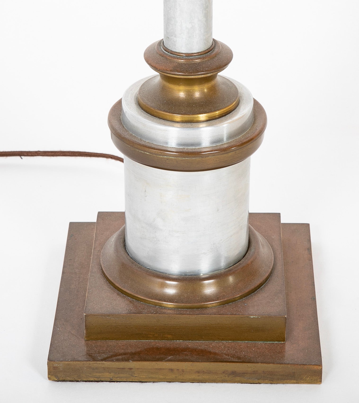 A Mid-Century Brass & Polished Metal Floor Lamp