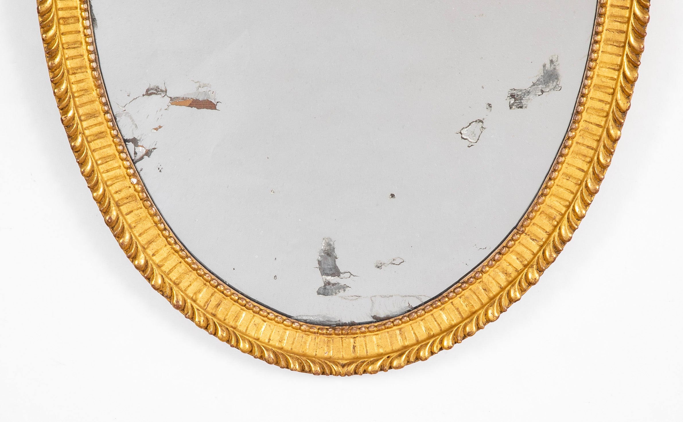 Oval French Mirror with Carved Gilt Wood Frame