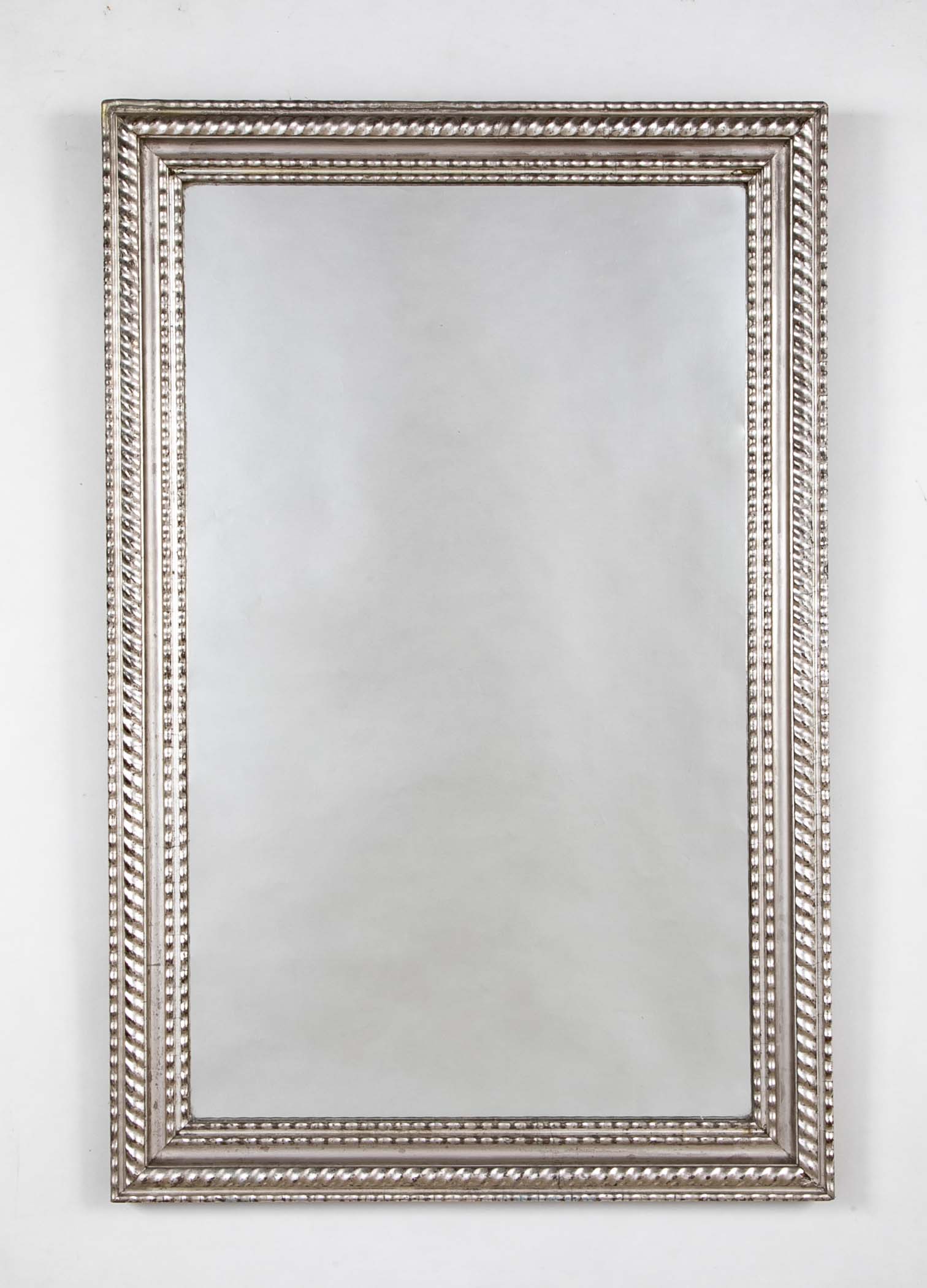 A Louis Philippe Carved and Silver Gilt Wood Framed Mirror