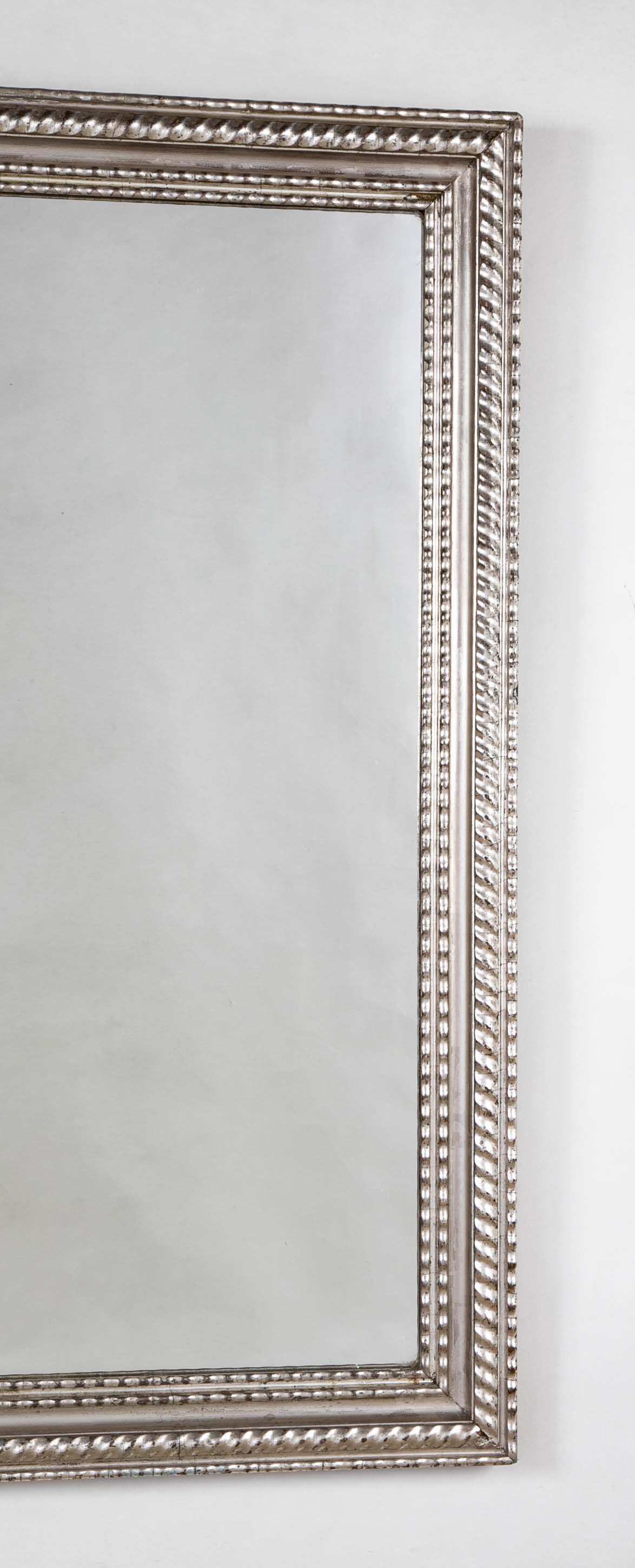 A Louis Philippe Carved and Silver Gilt Wood Framed Mirror