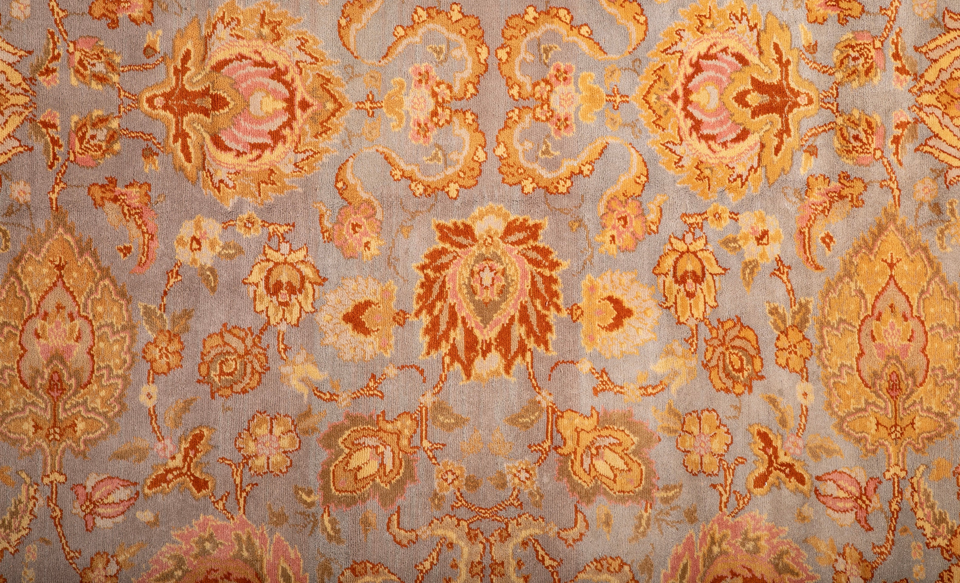 A Spanish Wool Carpet Having Floral Motifs