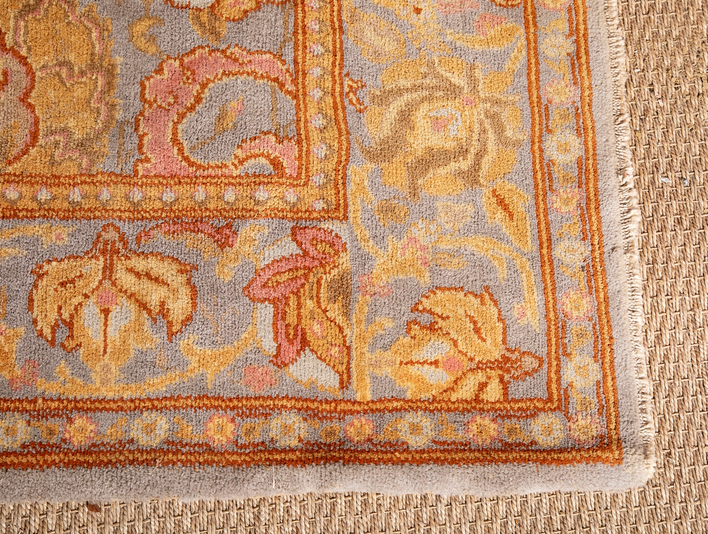A Spanish Wool Carpet Having Floral Motifs