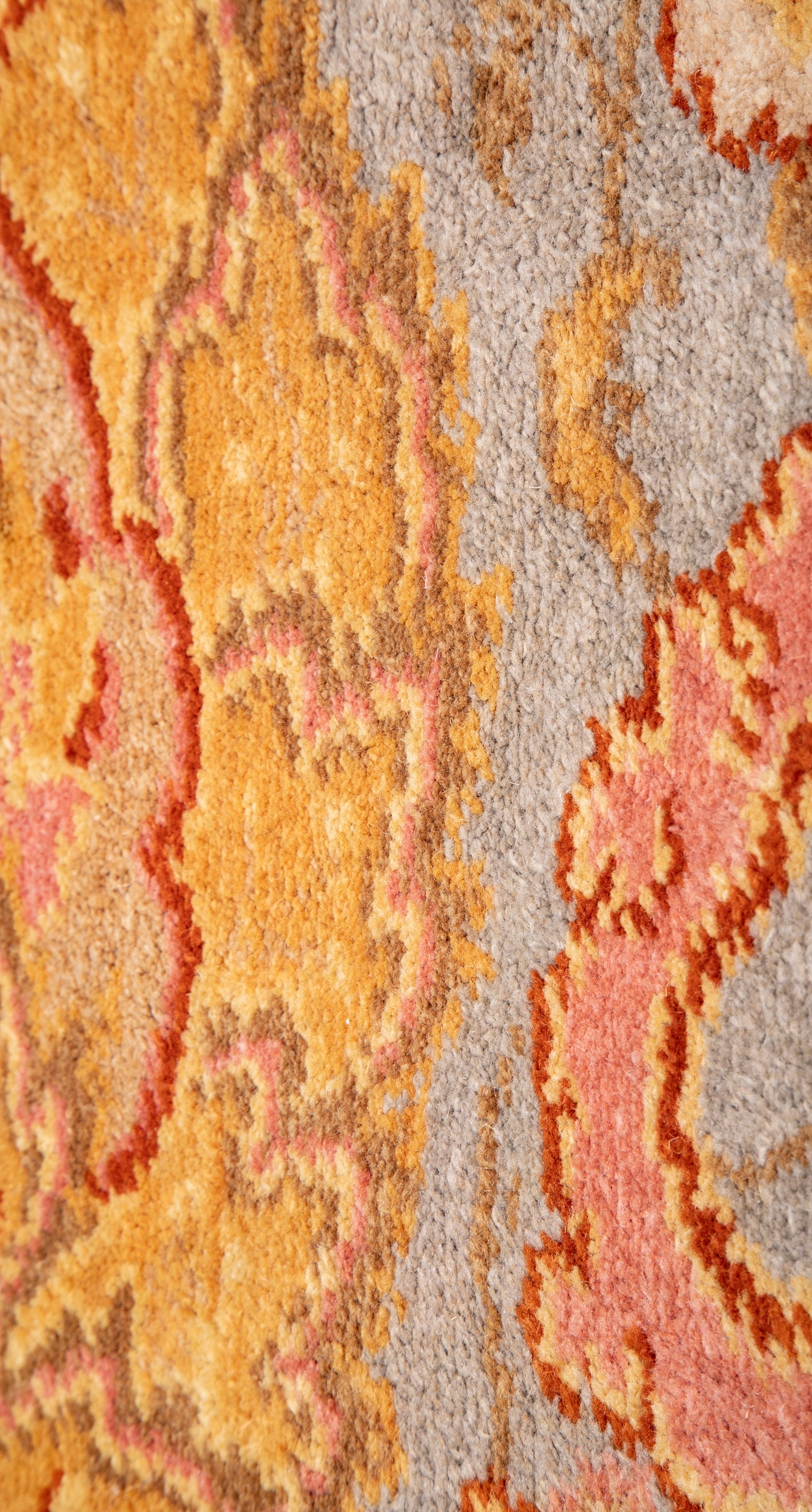 A Spanish Wool Carpet Having Floral Motifs
