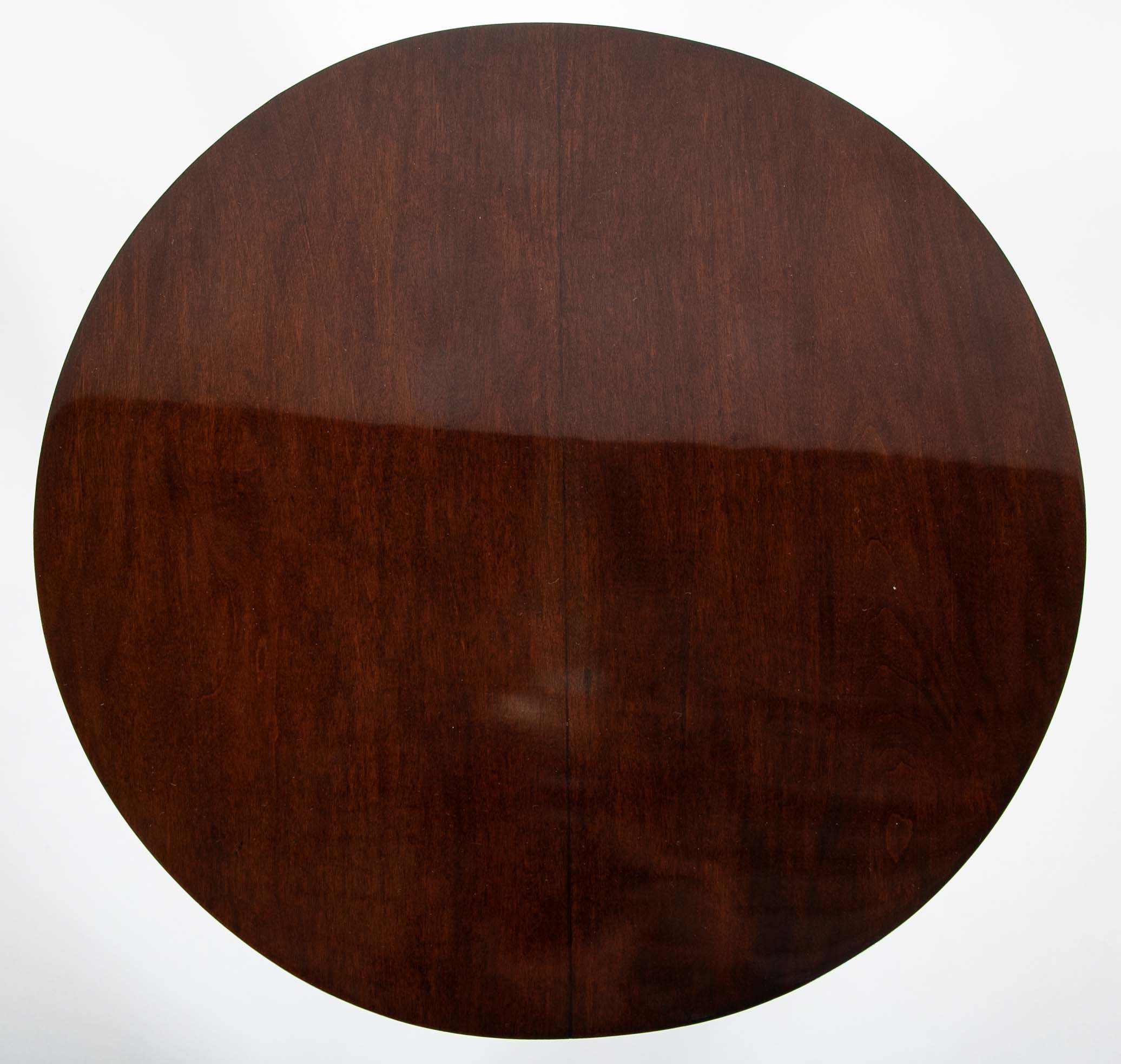 Pair of Round Mahogany Side Tables Attributed to Jacques Quinet