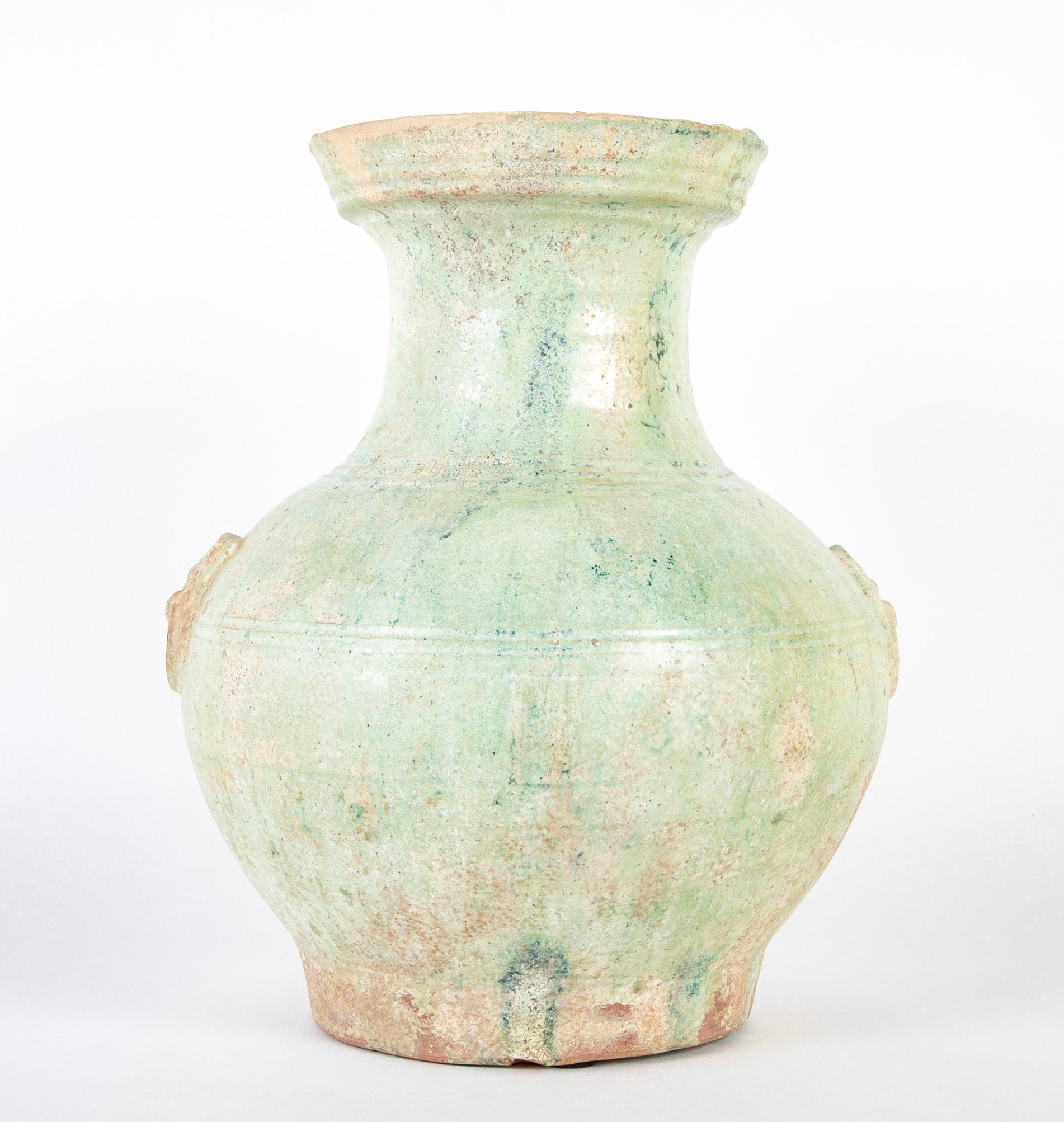 Han Dynasty Pottery Jar with Green Glaze and Molded Masks as Applied Handles